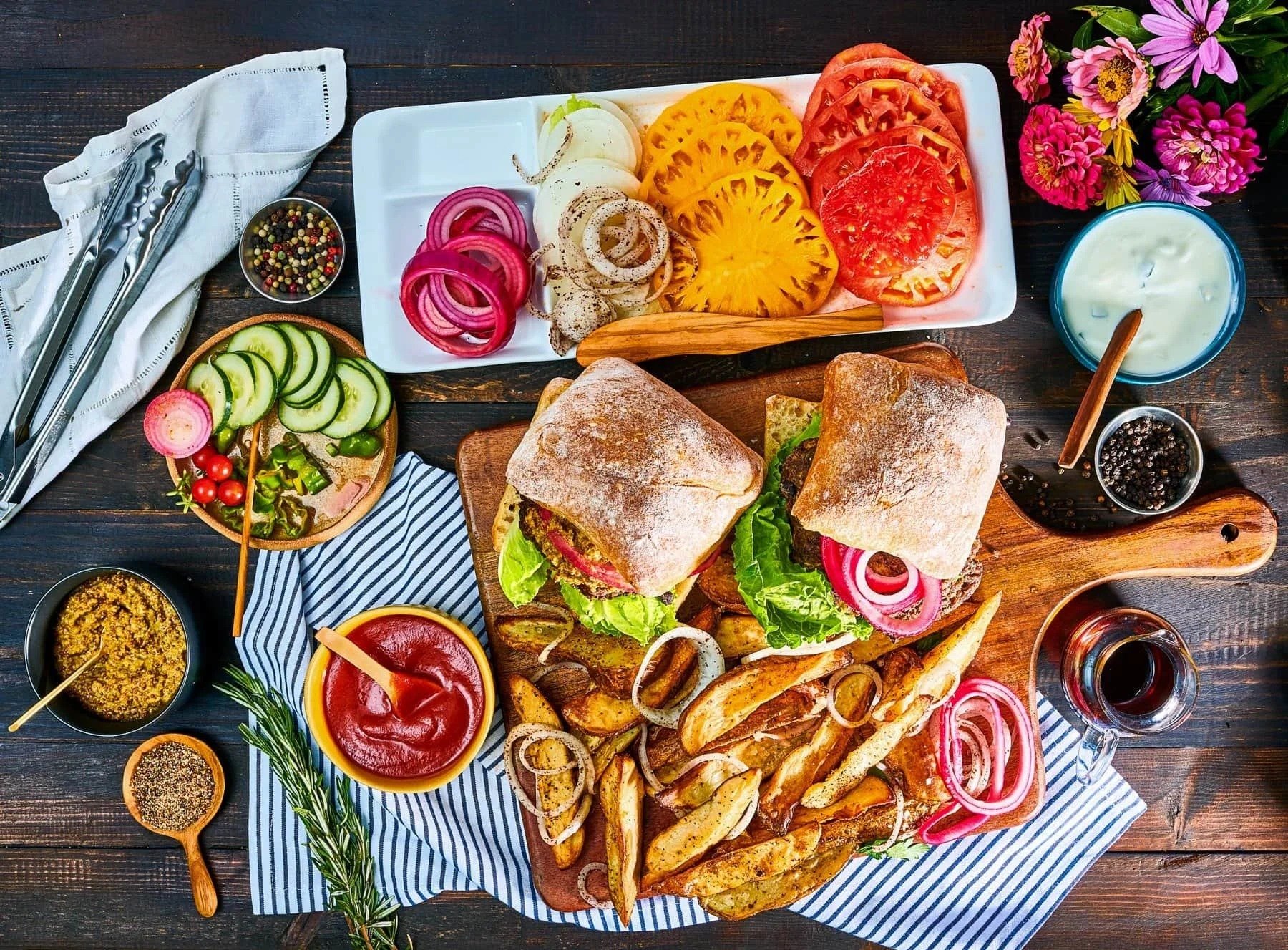 Food styling: veggie burger spread with toppings and fries