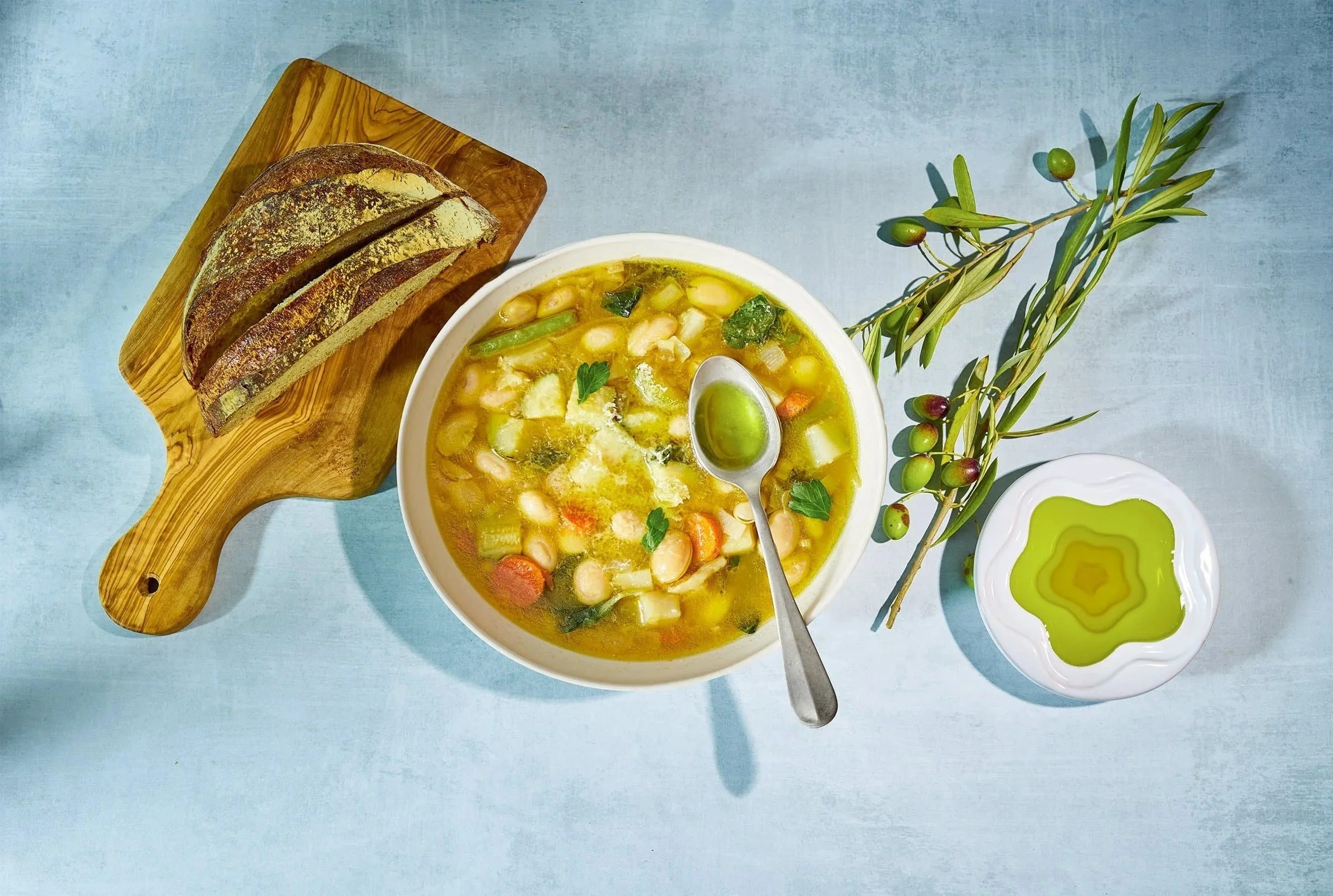 Food styling: bean soup with olive oil and bread