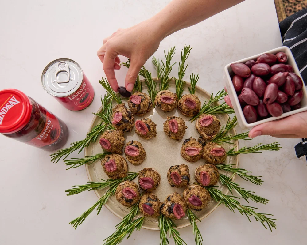 Holiday appetizer wreath made with Lindsay olives. Seasonal entertaining recipe photography.