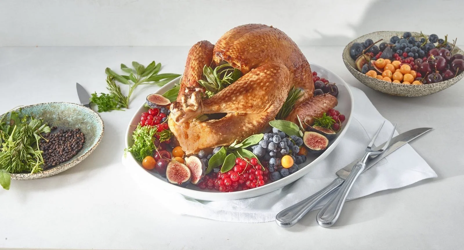 Food styling: roast turkey platter garnished with figs and berries