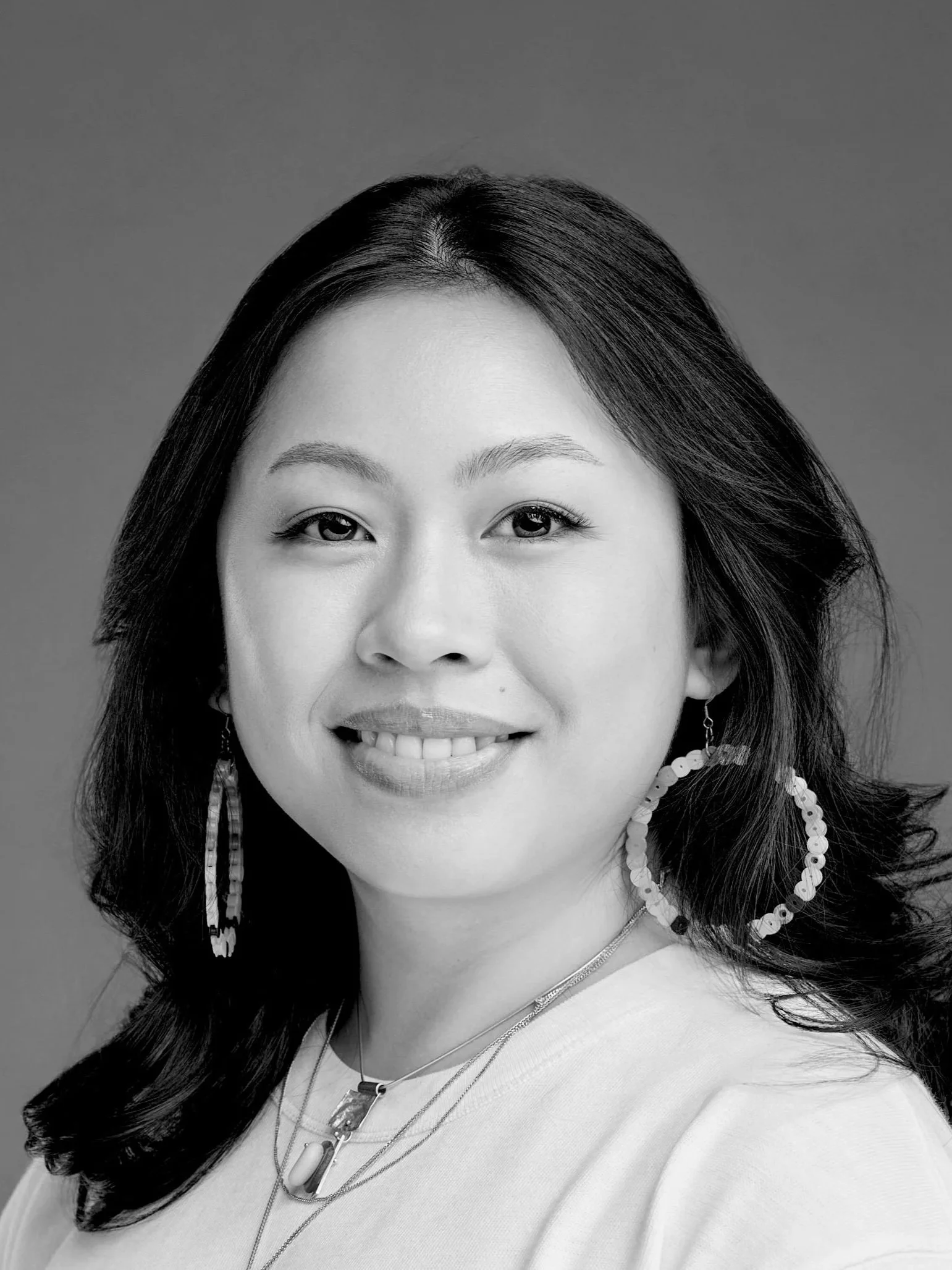 A black and white headshot of Squarespace web designer, Marya Nguyen