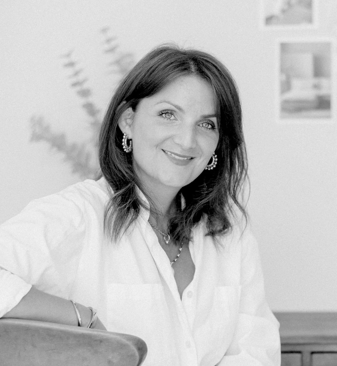A black and white photo of Elizabeth Ellery smiling at the camera