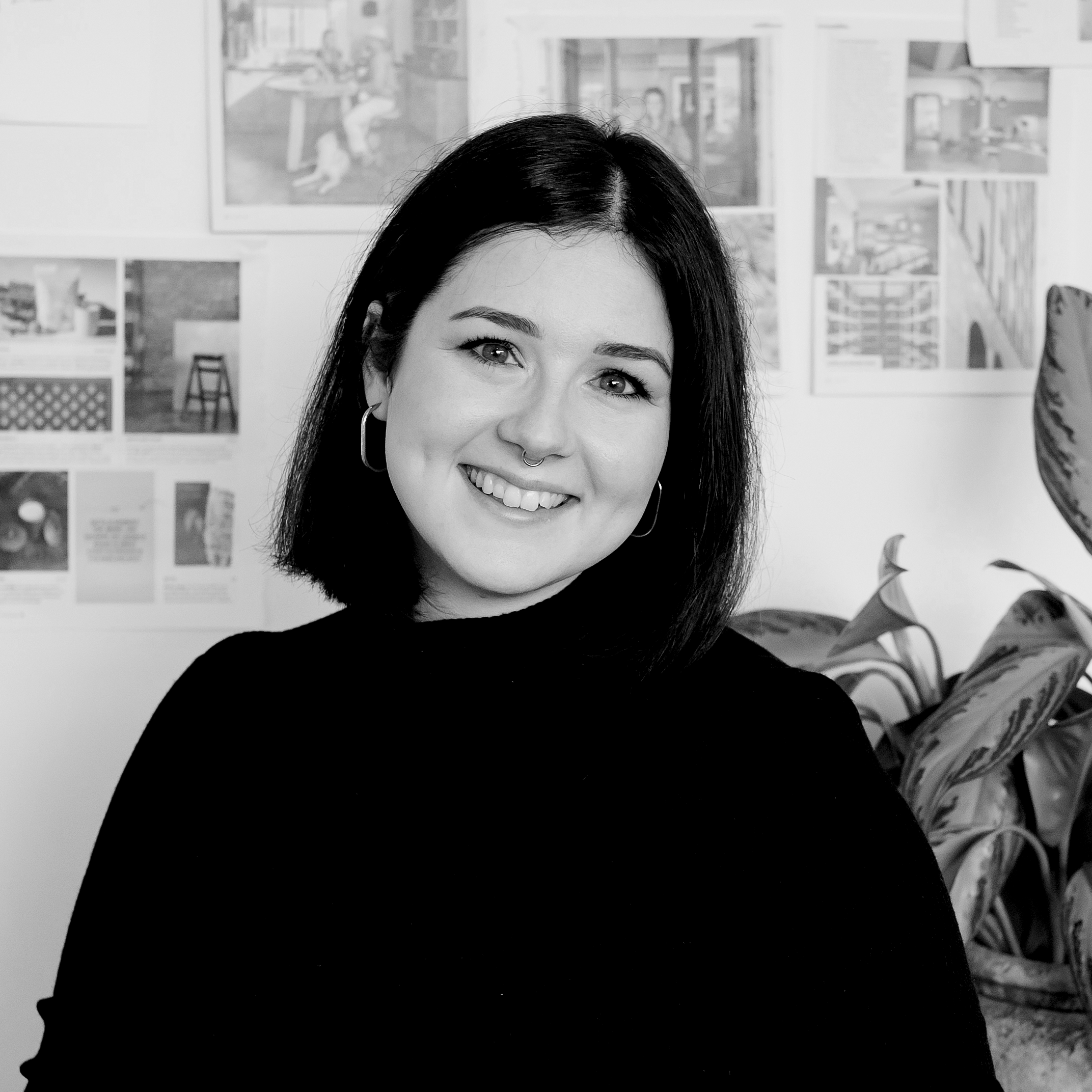 A headshot of Emily Lewis in black and white