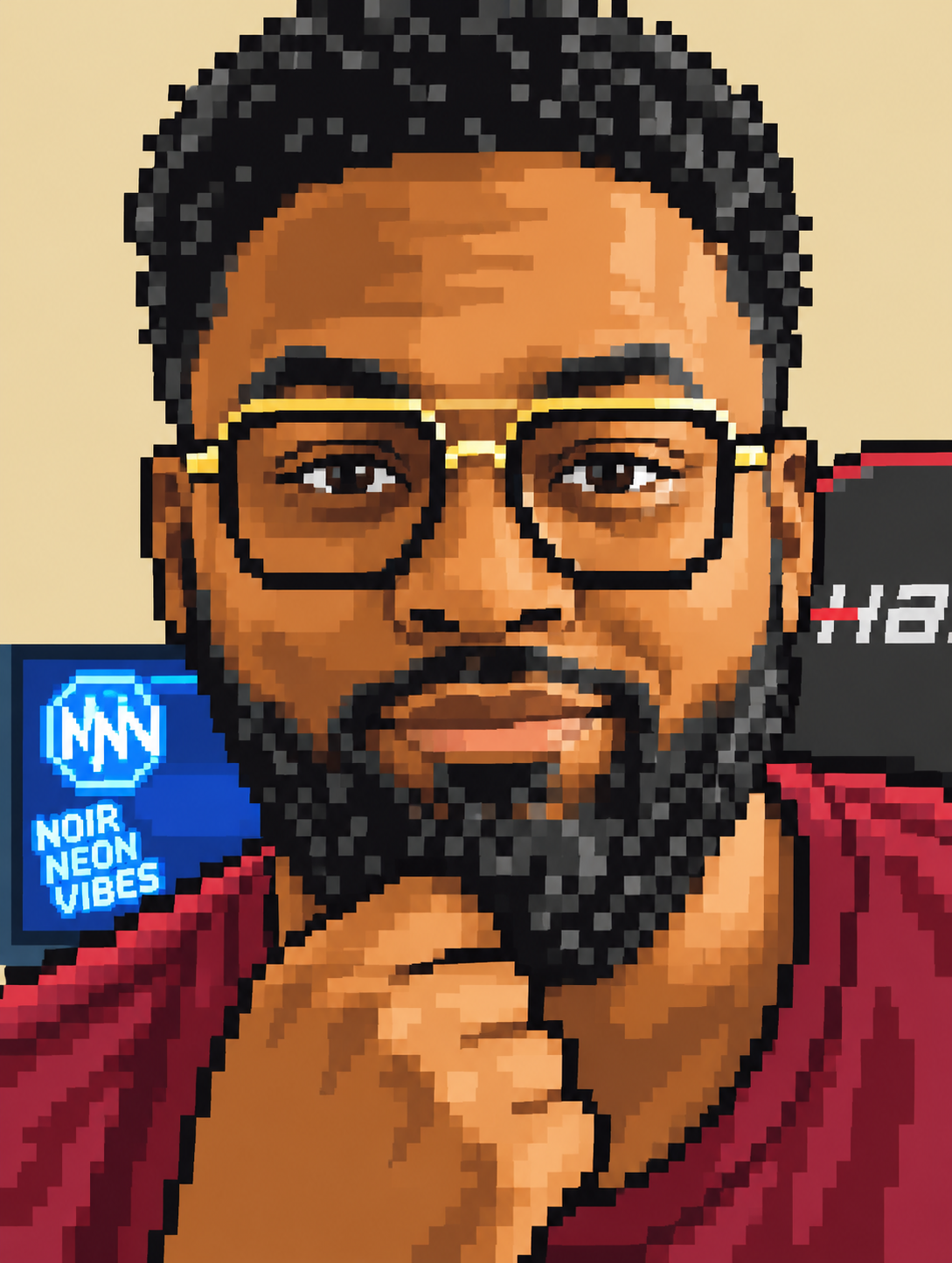 A young man with glasses and a beard, wearing a red shirt, is looking at the camera while touching his chin with one hand. In the background, there is a TV screen with a 