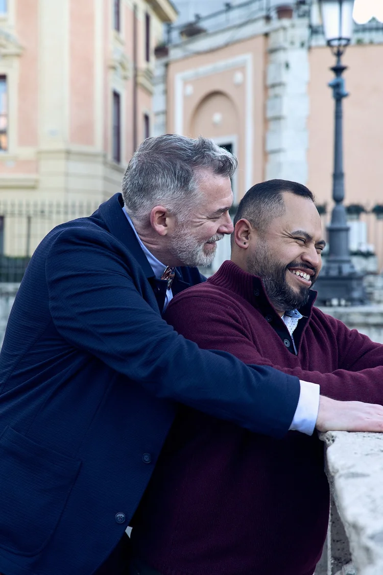 Couple in navy and burgundy embracing in a Rome piazza in winter