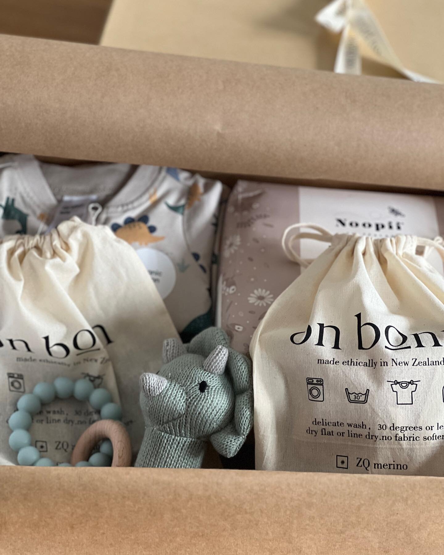 I sometimes put together wee baby gift boxes when someone in work has a baby. Here&rsquo;s today&rsquo;s wee set up. Some lovely @noopiinz nappies, a wee wood and silicone teether, a soft rattle and some On Bonn goodies, a navy newborn twozee, and ma