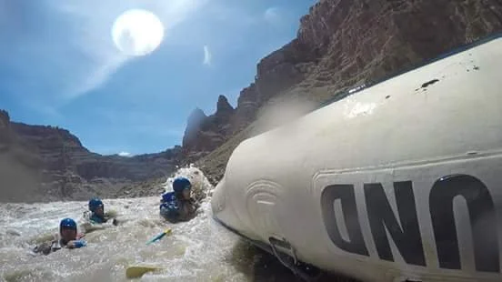 Veterans swimming rapid after raft flip in Big Drop II Cataract Canyon Colorado River.