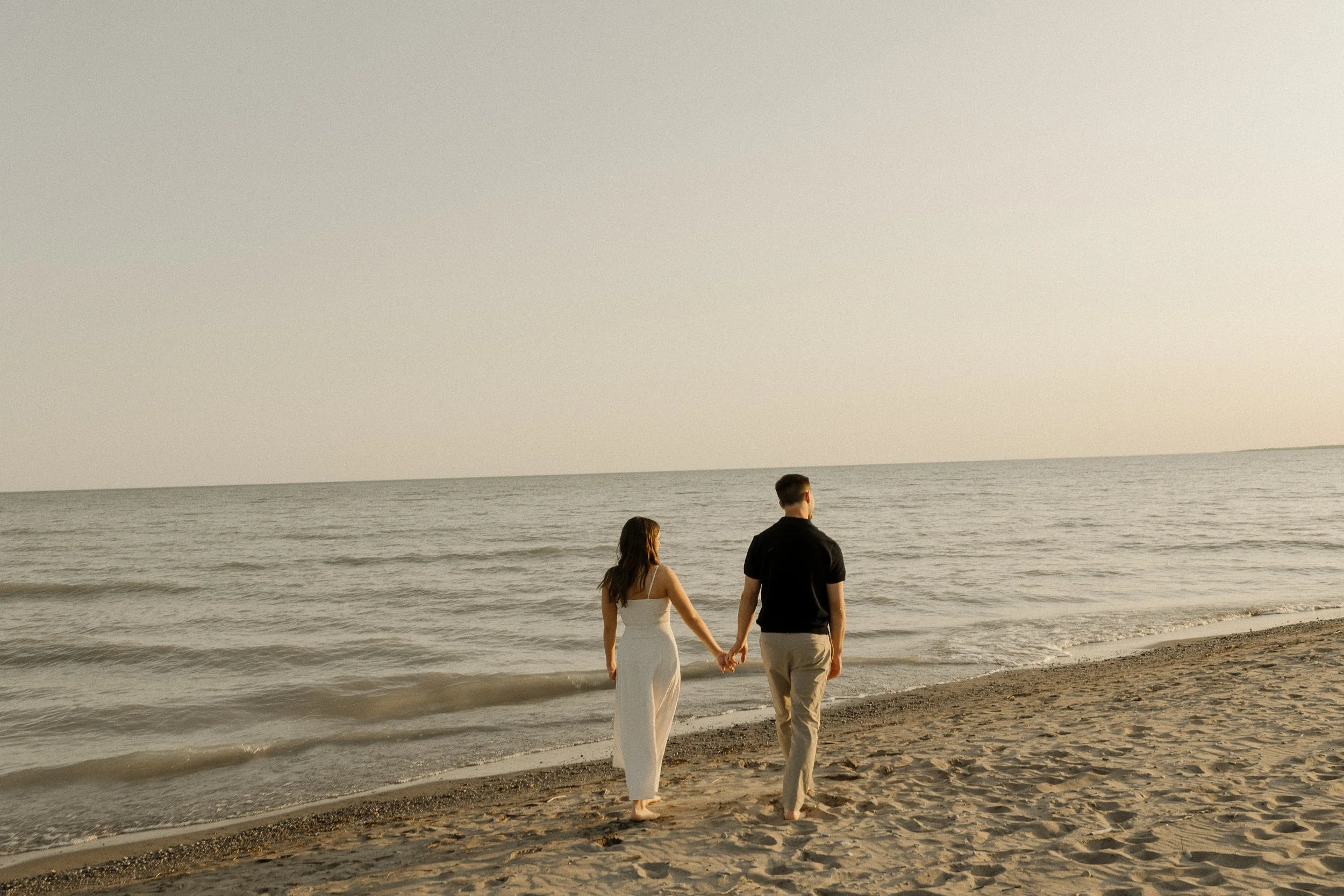 cinematic engagement photos on the beach in Ontario