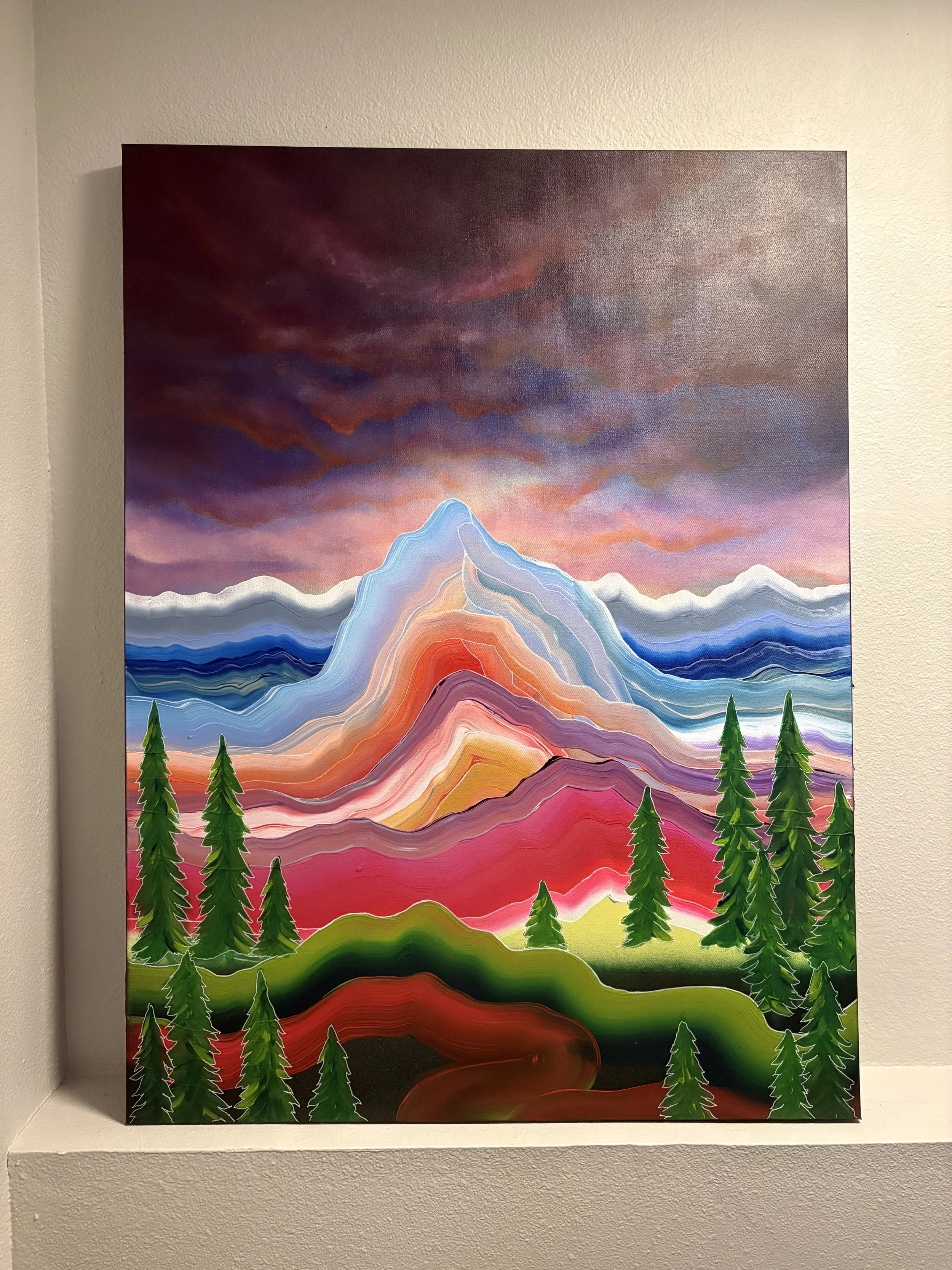 Even Under Dark Skies painting by Colorado artist Jessie Belisle — vibrant layered mountain landscape beneath a dark dramatic sky with evergreen trees.
