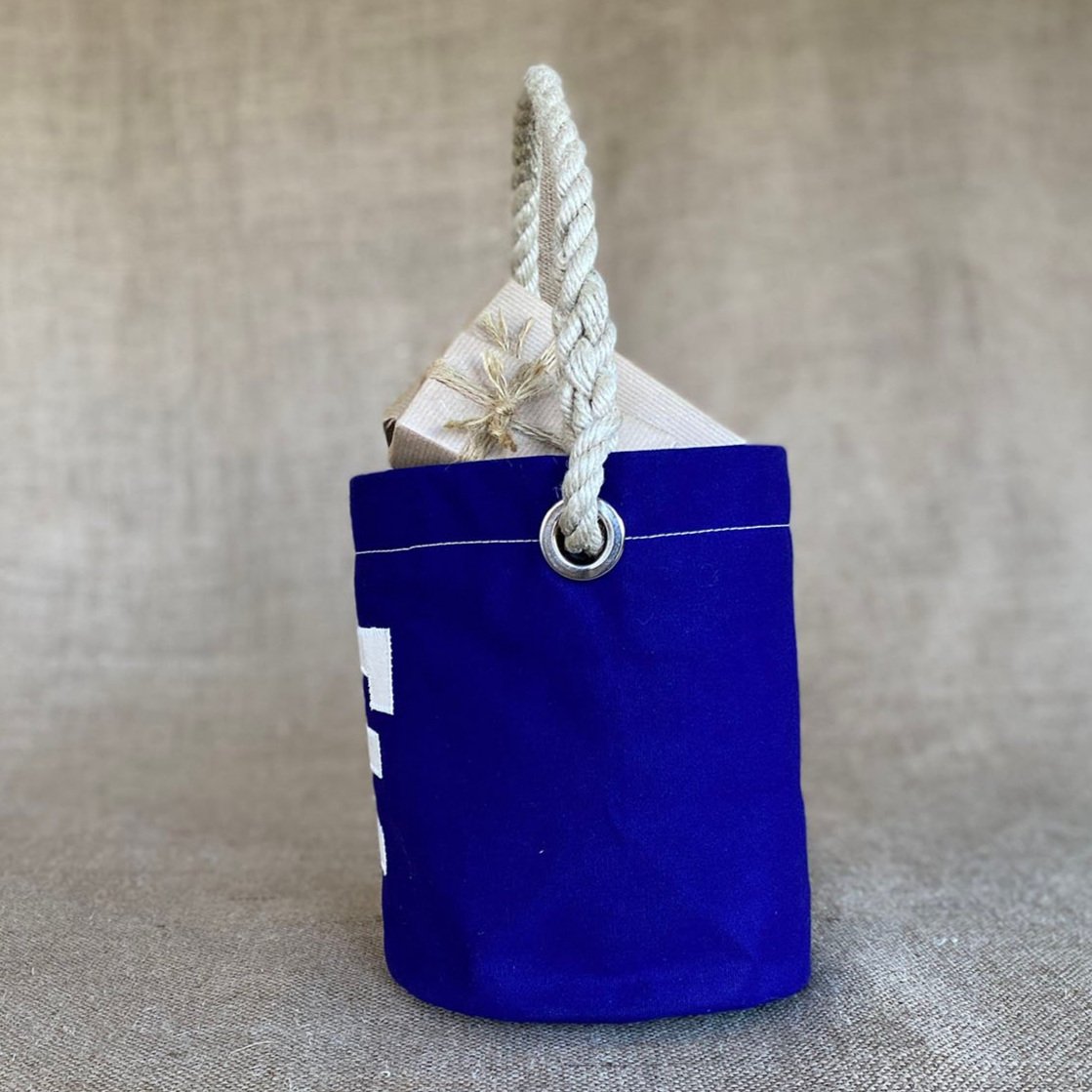 Side view of personalised traditional Ditty Bag, cream letter stitched to front.