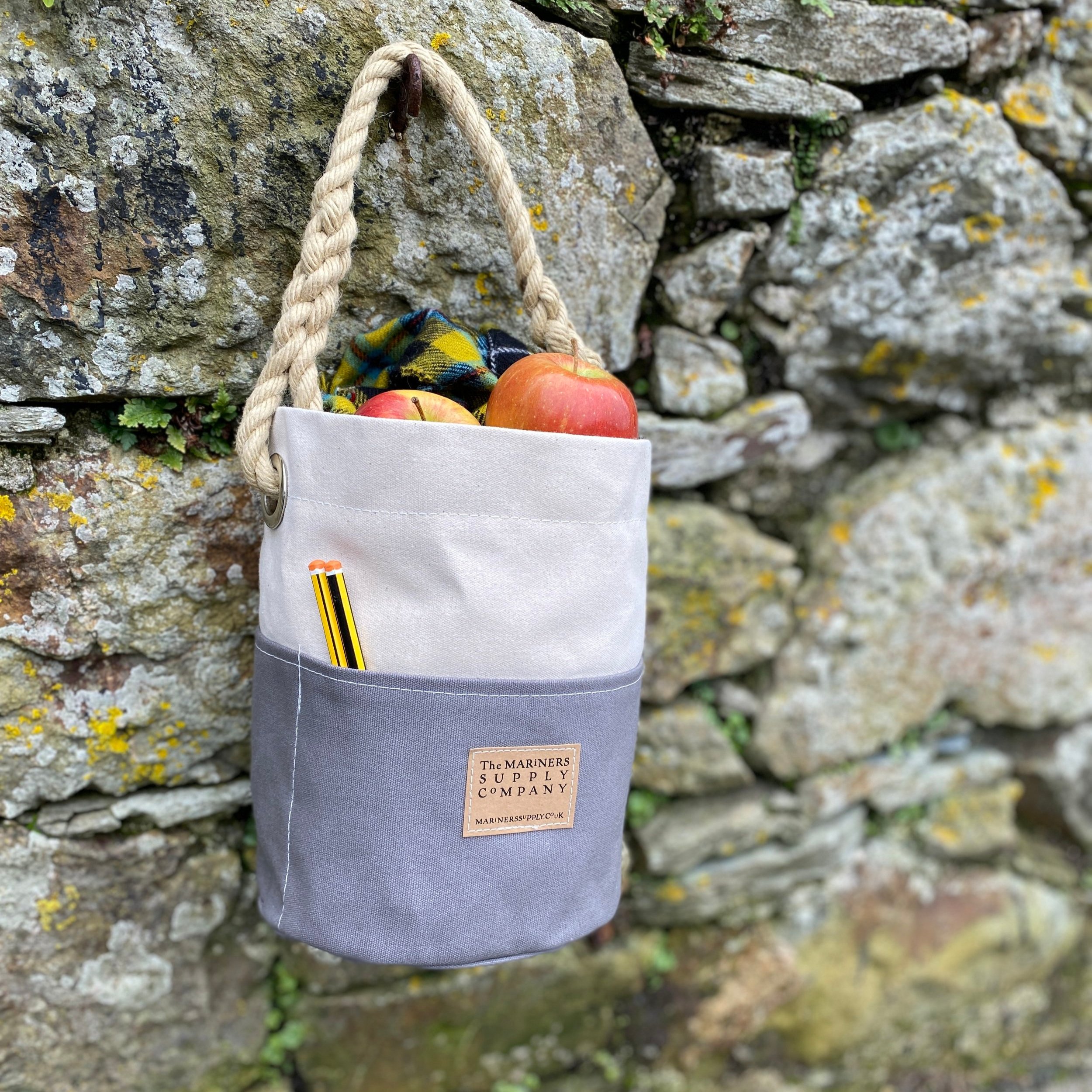 Nautical ditty bag in grey and cream traditional canvas with rope handle.