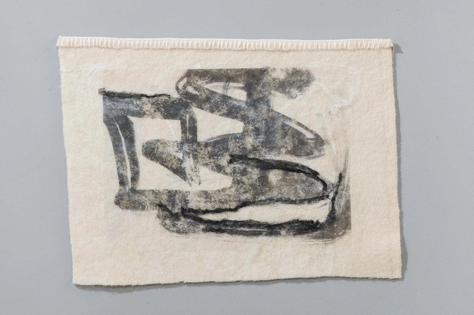 SIGNATURE. 40 x 30cm unframed. Ink on embellished organdie & found blanket.
