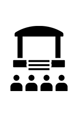 Audience viewing a presentation on a stage with a large screen