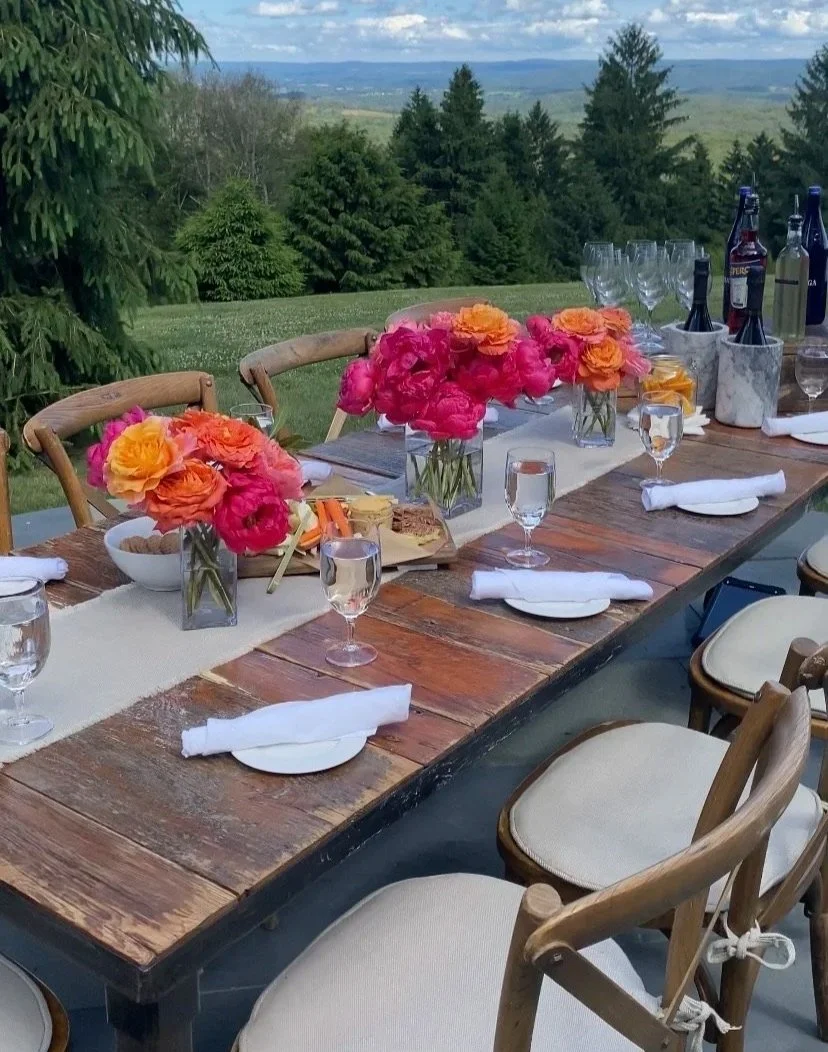 Countryside wedding venue with an outdoor reception table setup, showcasing thoughtful wedding venue layout planning.
