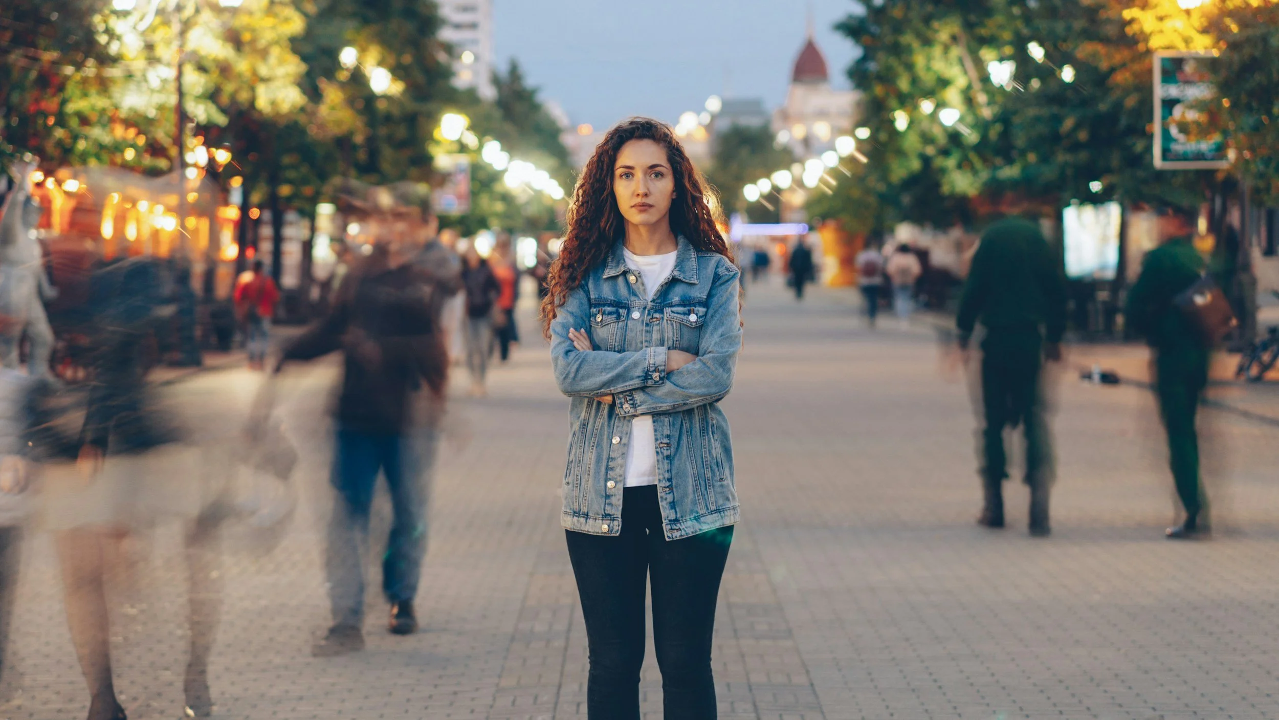 woman alone in a crowd internalizing blame