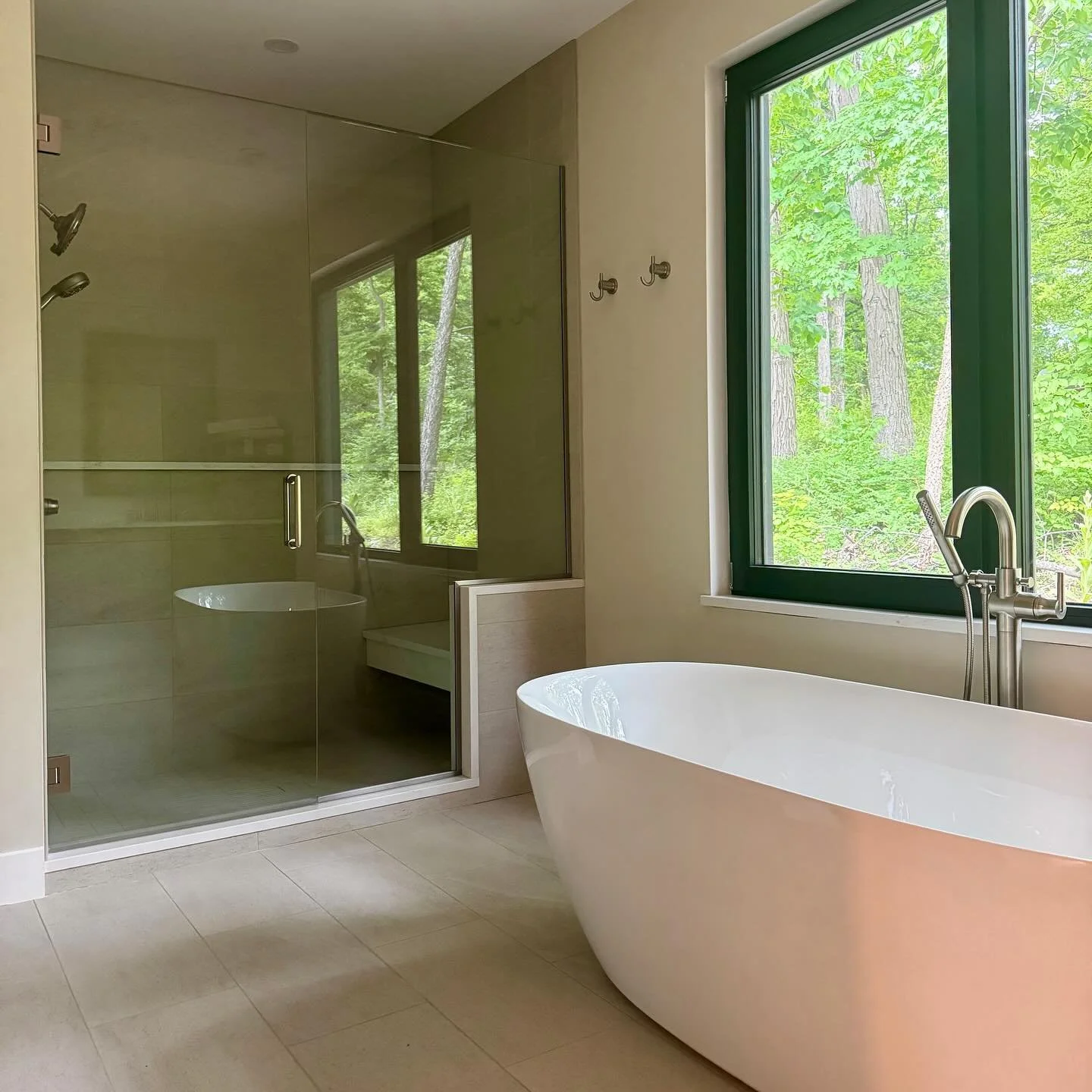This whole-home new construction design project is elevated in the trees, and from the very beginning, we built the design around five guiding words: Contemporary, Natural, Organic, Relaxed, and Warm. (Swipe for a small, partial glimpse of the spring