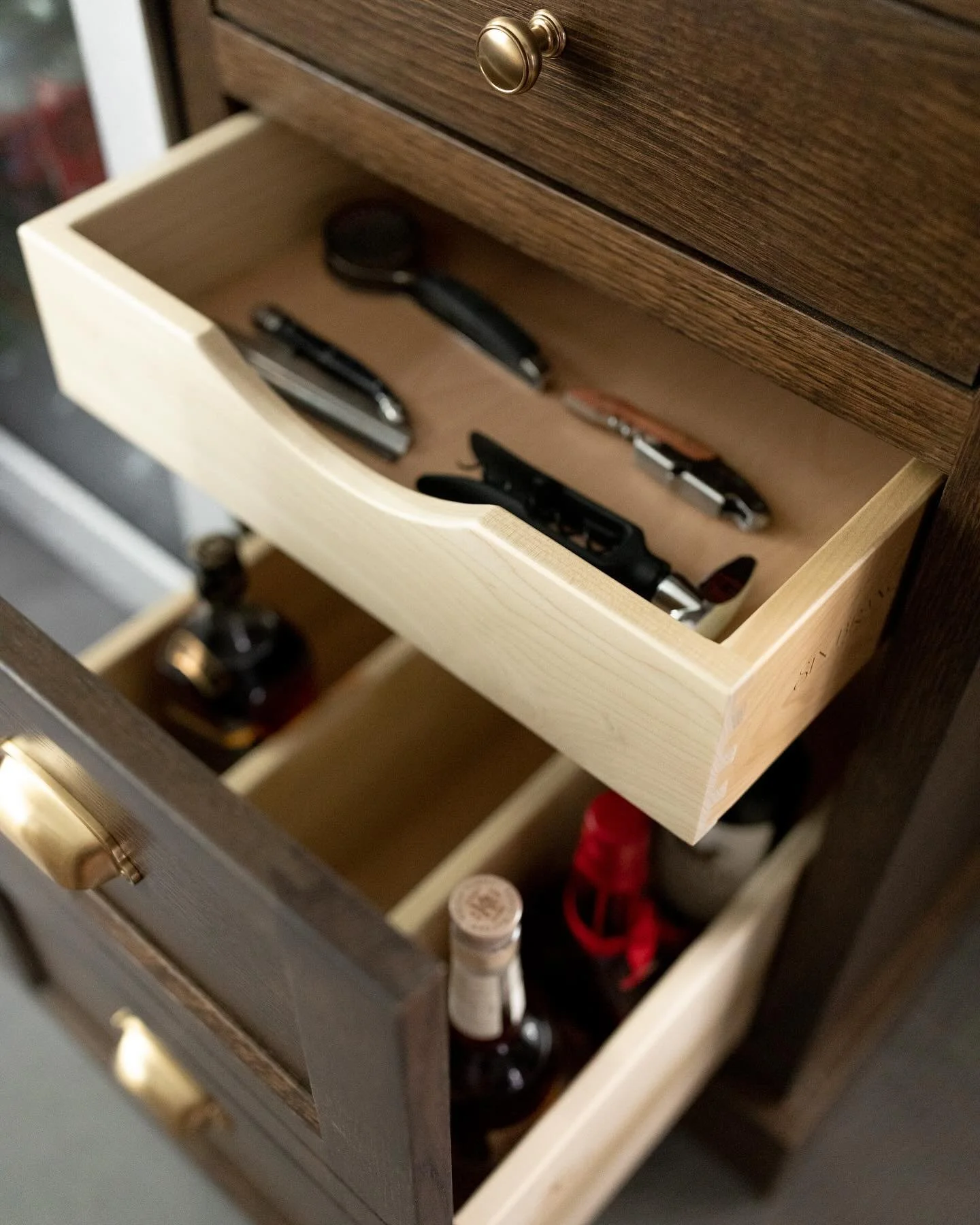 Flashback to this custom liquor &amp; bar tool drawer we designed and @sixbranchcustomwoodworking perfectly executed! The faux double drawer front keeps perfect symmetry while housing all of the clients needs to make the perfect cocktail.

GC: @aarow