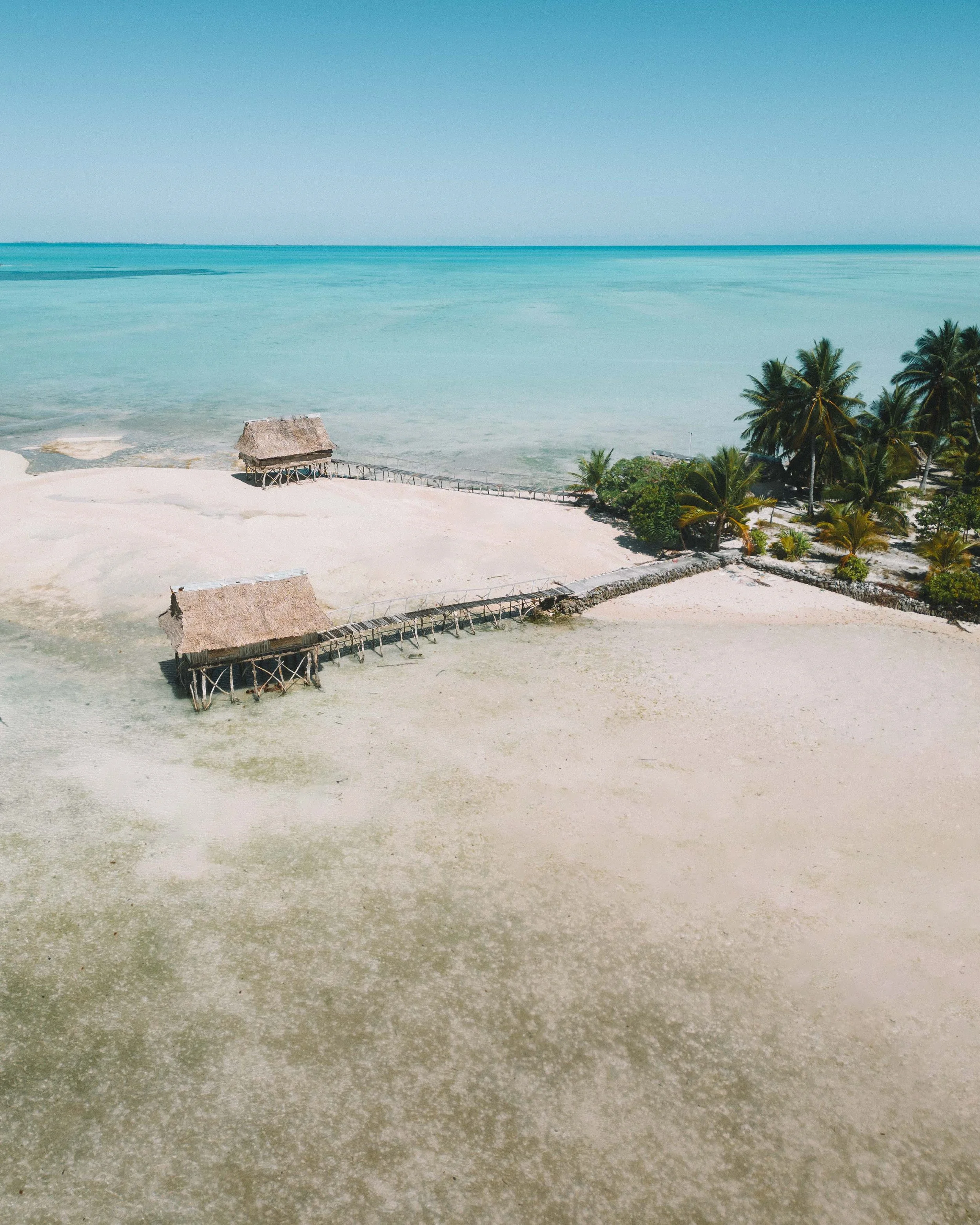 drone shot of overwater bungalows buia in tarawa kiribati