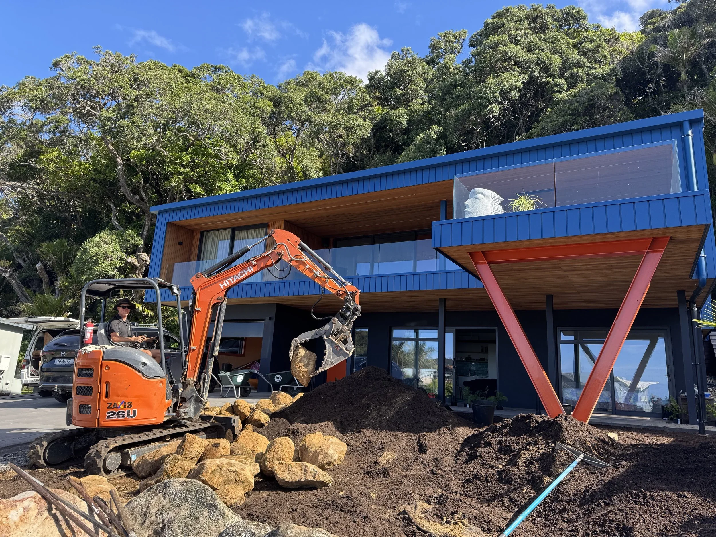 landscaping-rock-placement-digger.webp
