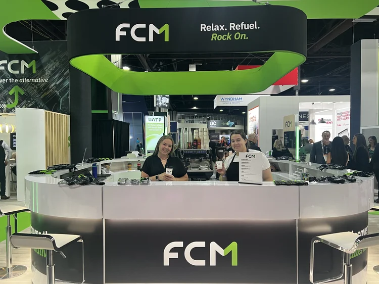 Aviator baristas serving at a trade show booth