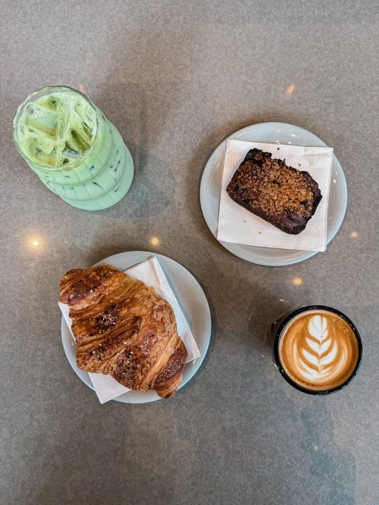 Latte, matcha, and pastries at Aviator Coffee