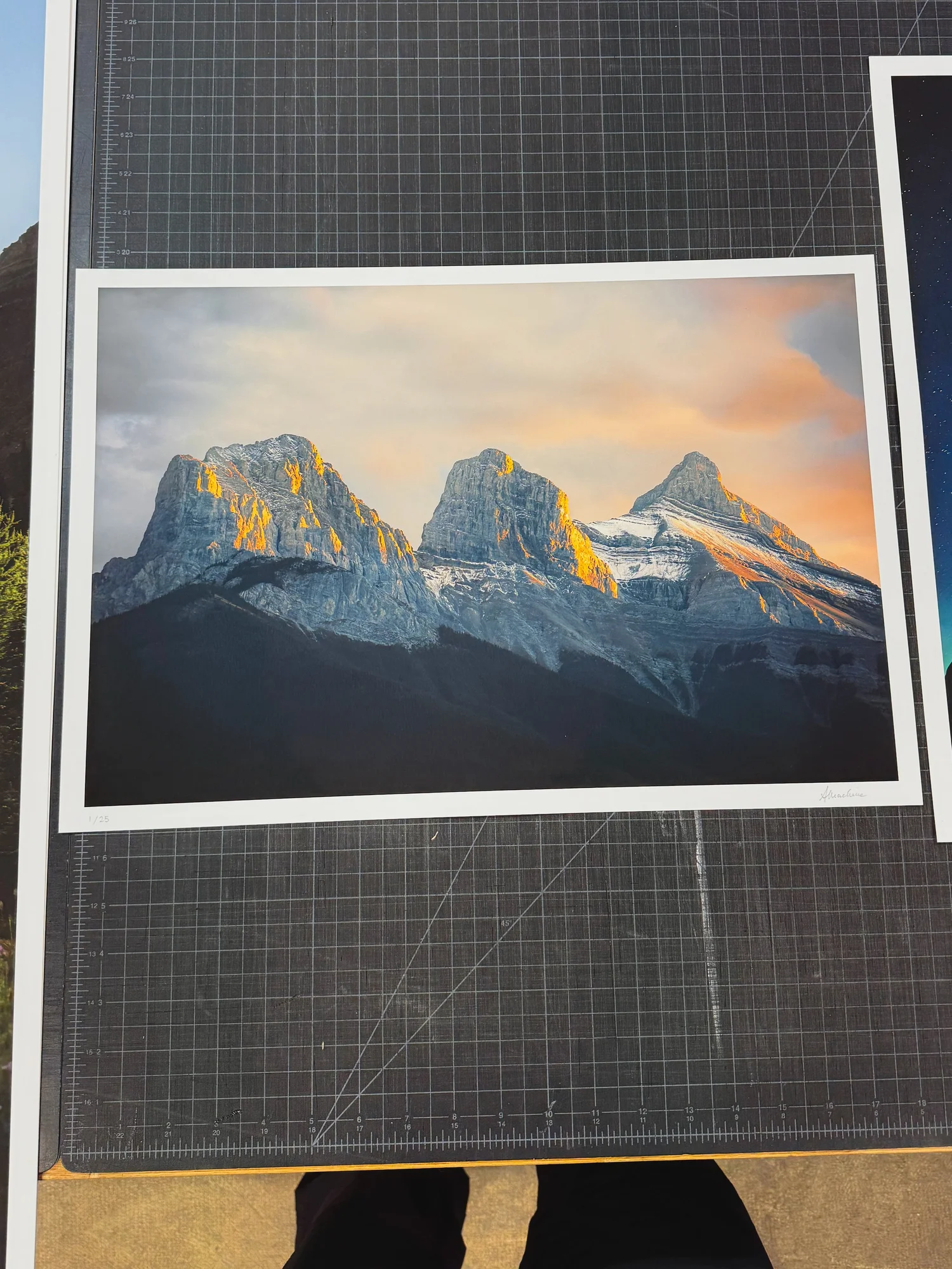 Light of Day fine art print of the Three Sisters at sunrise, signed and laid out at Opus Vancouver