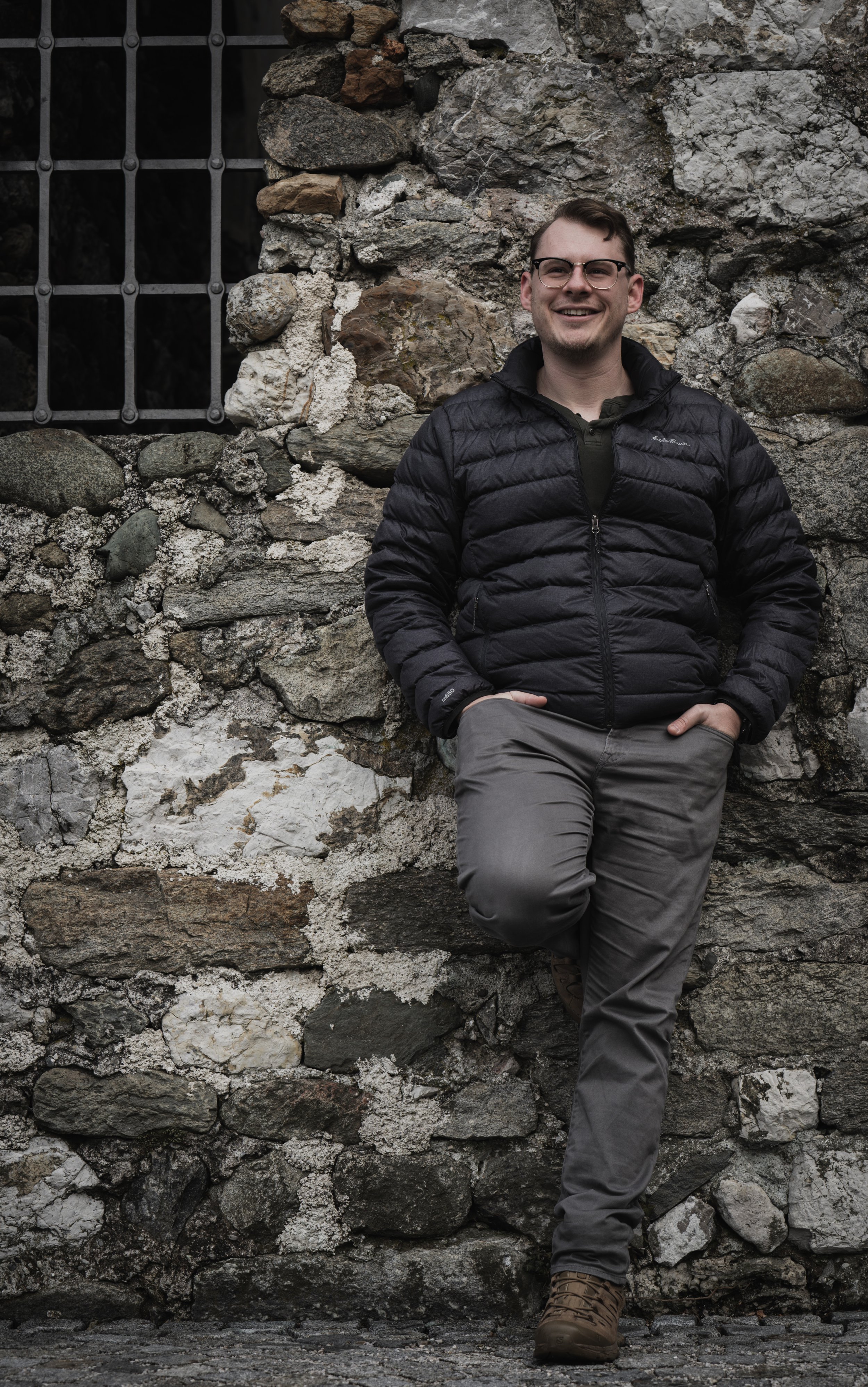 A man poses for a portrait outside Rattenberg, Austria, on Dec. 20, 2021. The ruins of Rattenberg's medieval castle sit on the hills overlooking the town. While most of it has been repurposed for special events and theater perofrmances, the rough sto