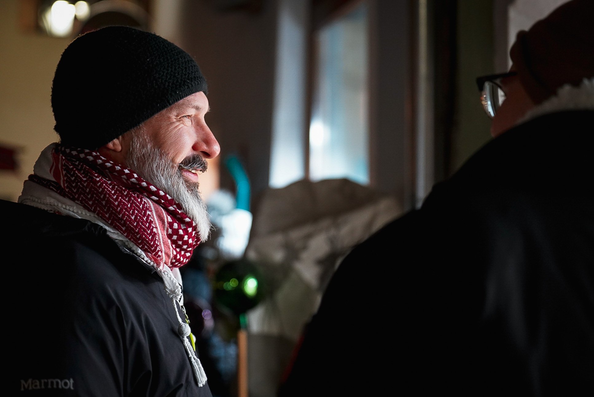 A man looks inside a glass blowing shop in Rattenberg, Austria, on Dec. 24, 2021. While the crowds were much smaller than years past, Rattenberg's Christmas market still drew a number of visitors. As shopkeepers assisted customers and food vendors di