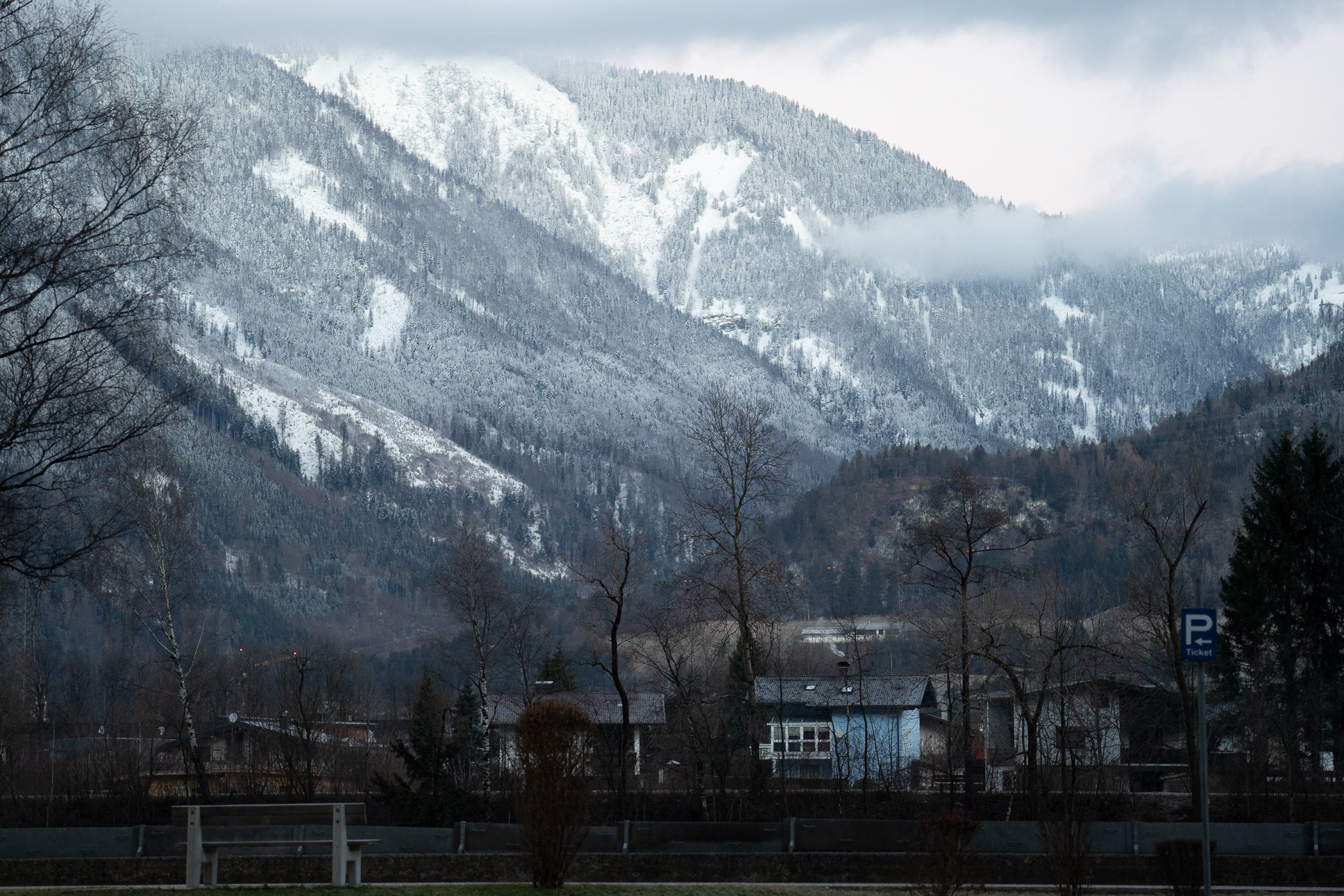 The icy Inn riverbank in Rattenberg, Austria, on Dec. 16, 2021. Most mornings I walked along the adjacent concrete path, nodding silently to the bundled up locals with their dogs. © Merit Davey 2021.