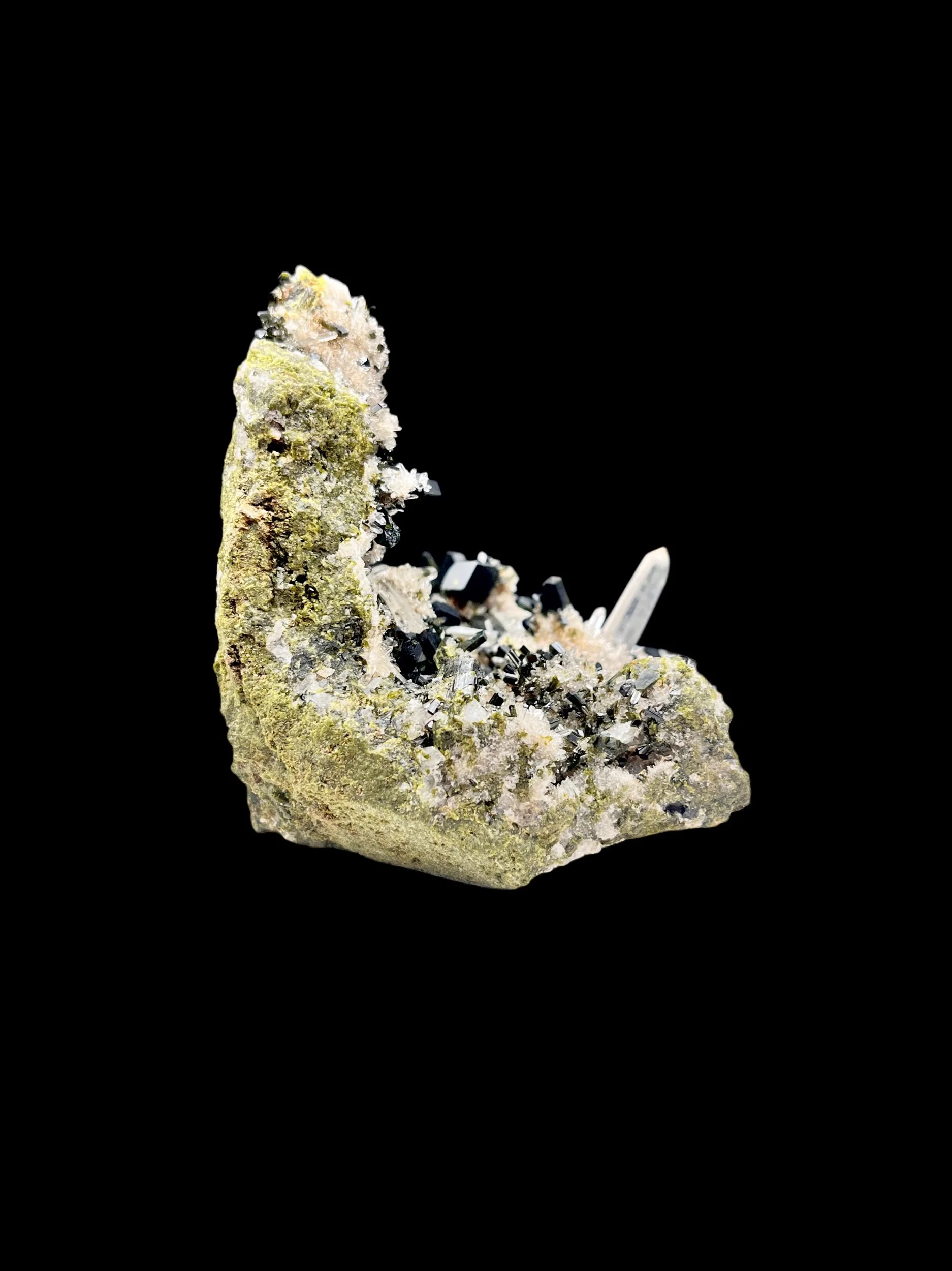 close up epidote crystals with quartz point Huaros Peru mineral specimen