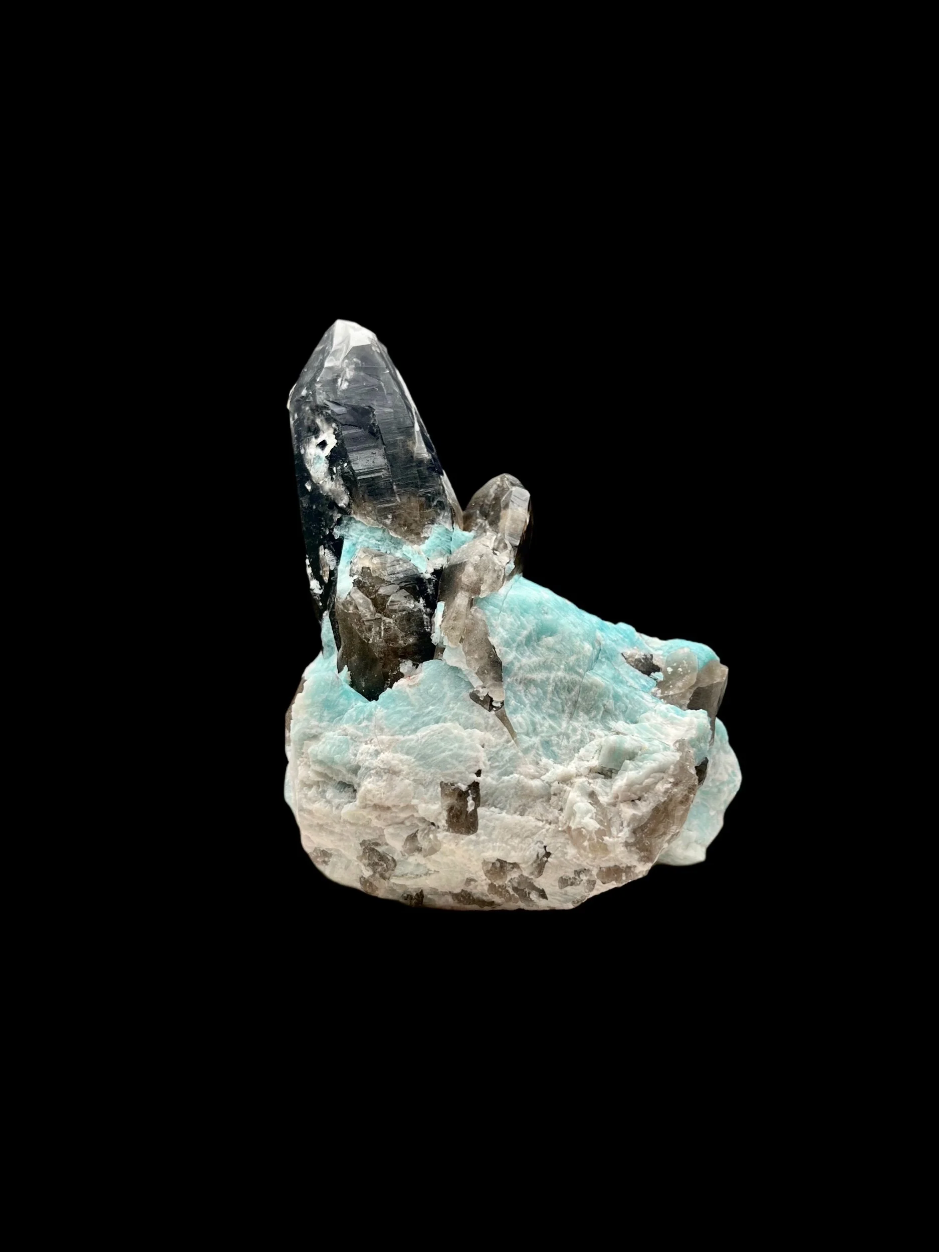 Natural amazonite and smoky quartz crystal formation on feldspar matrix