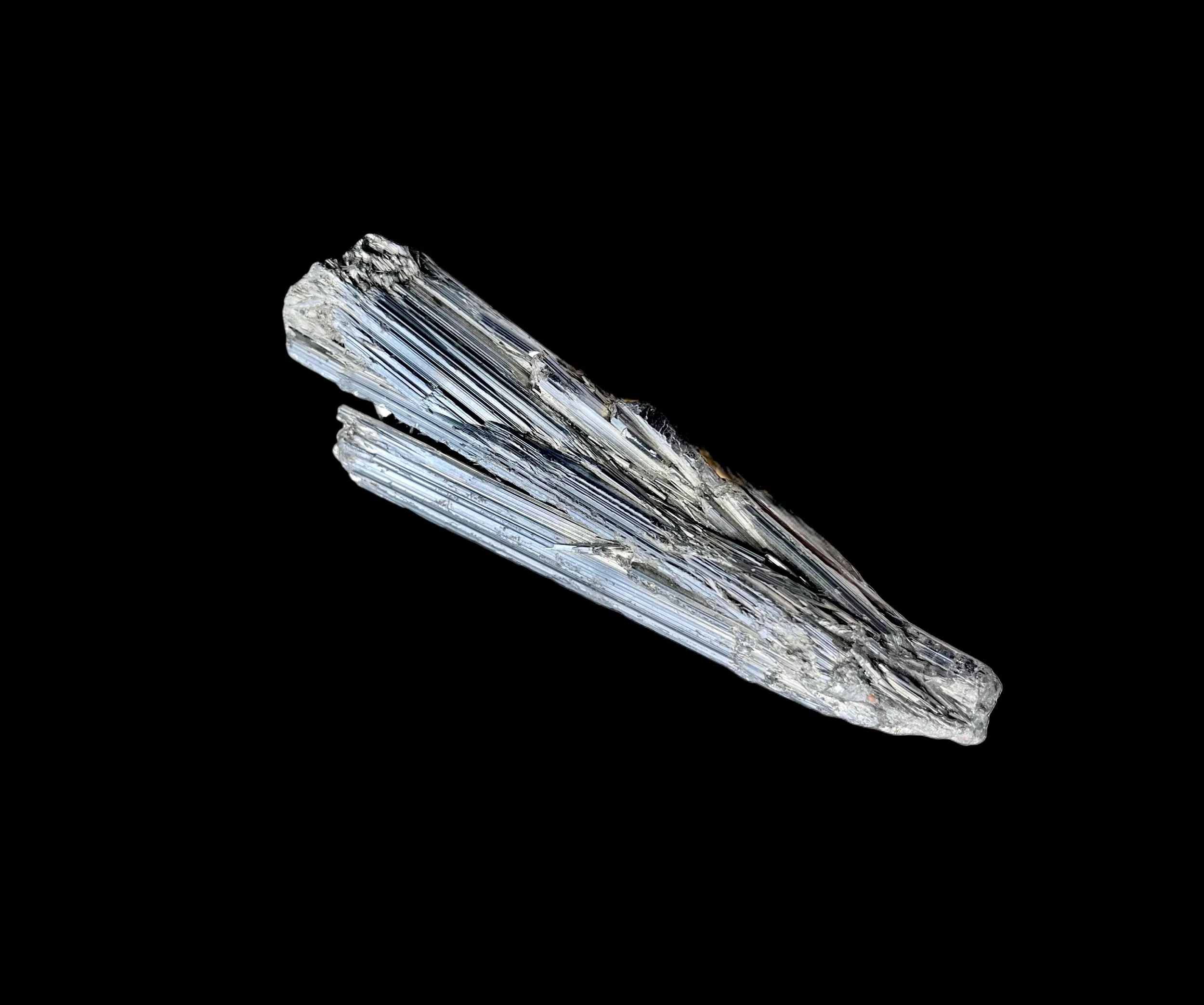 Stibnite close up striated crystal blades silver gray reflective mineral
