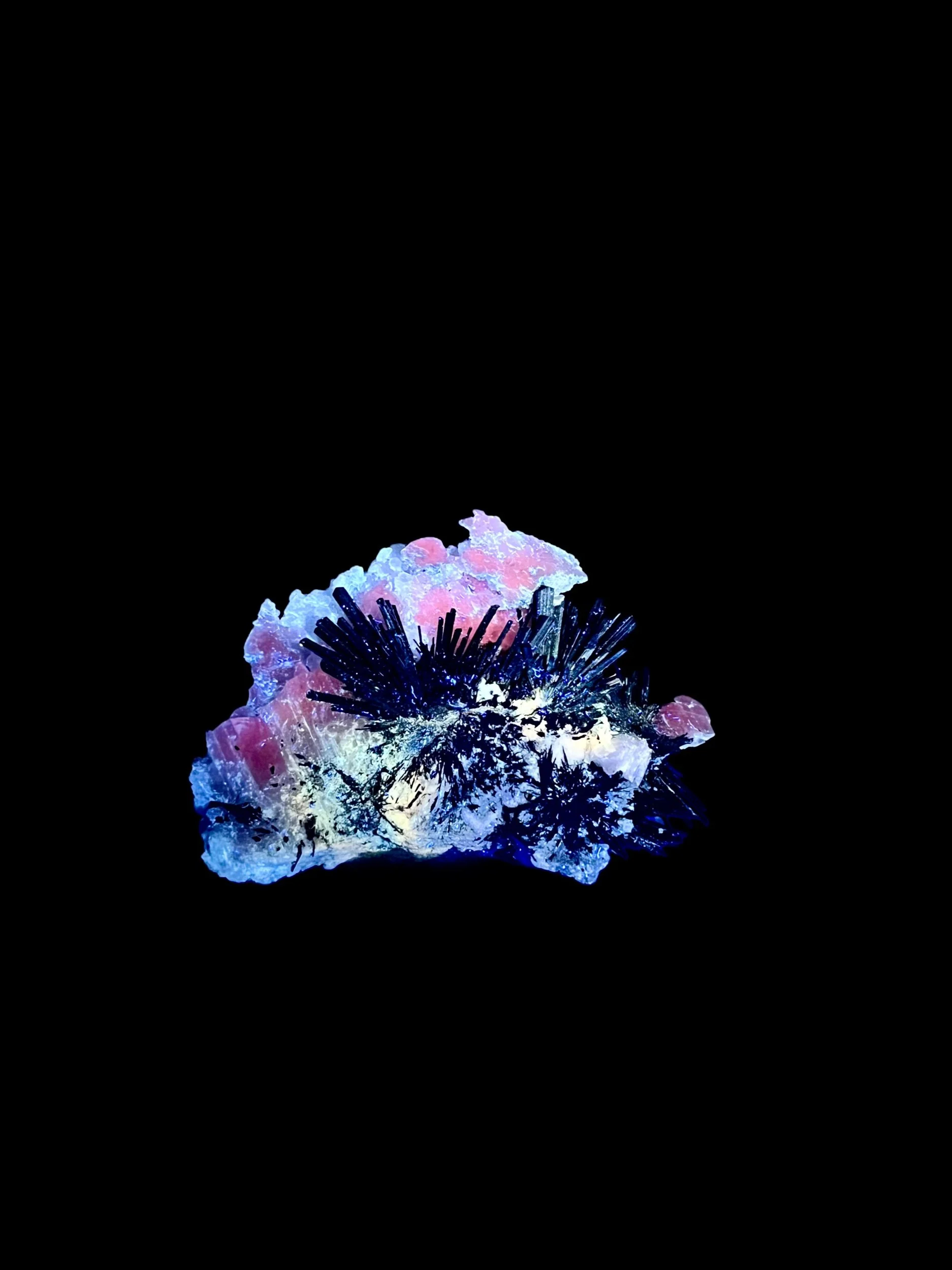 Radiating stibnite blades on calcite matrix UV reactive mineral specimen China