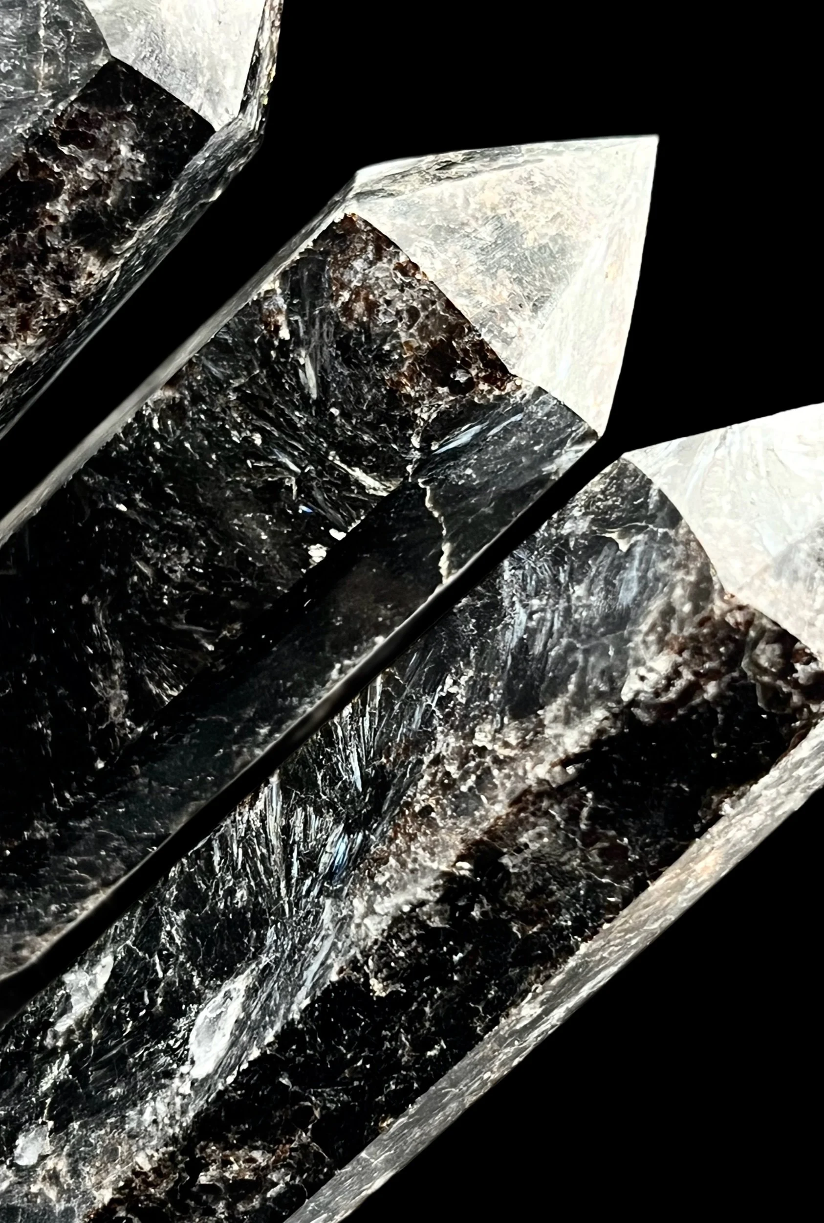 black crystal tower with chatoyant Arfvedsonite and garnet inclusions