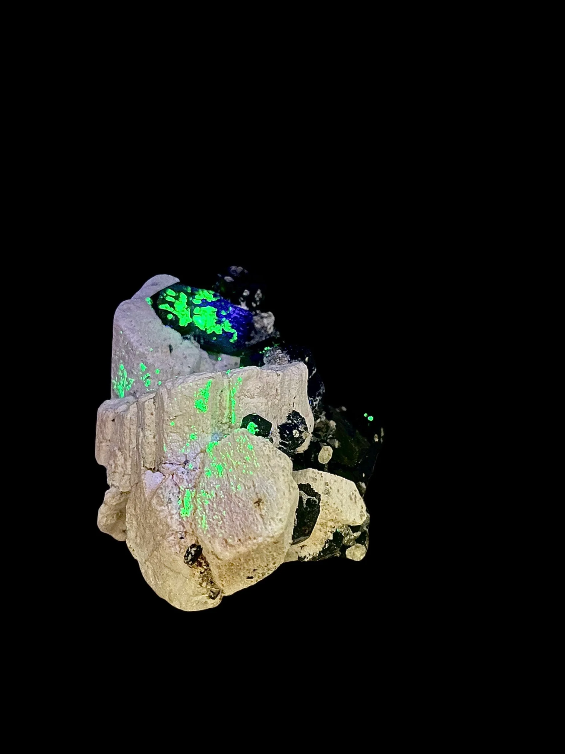 Schorl tourmaline crystals on feldspar matrix with UV reactive hyalite opal