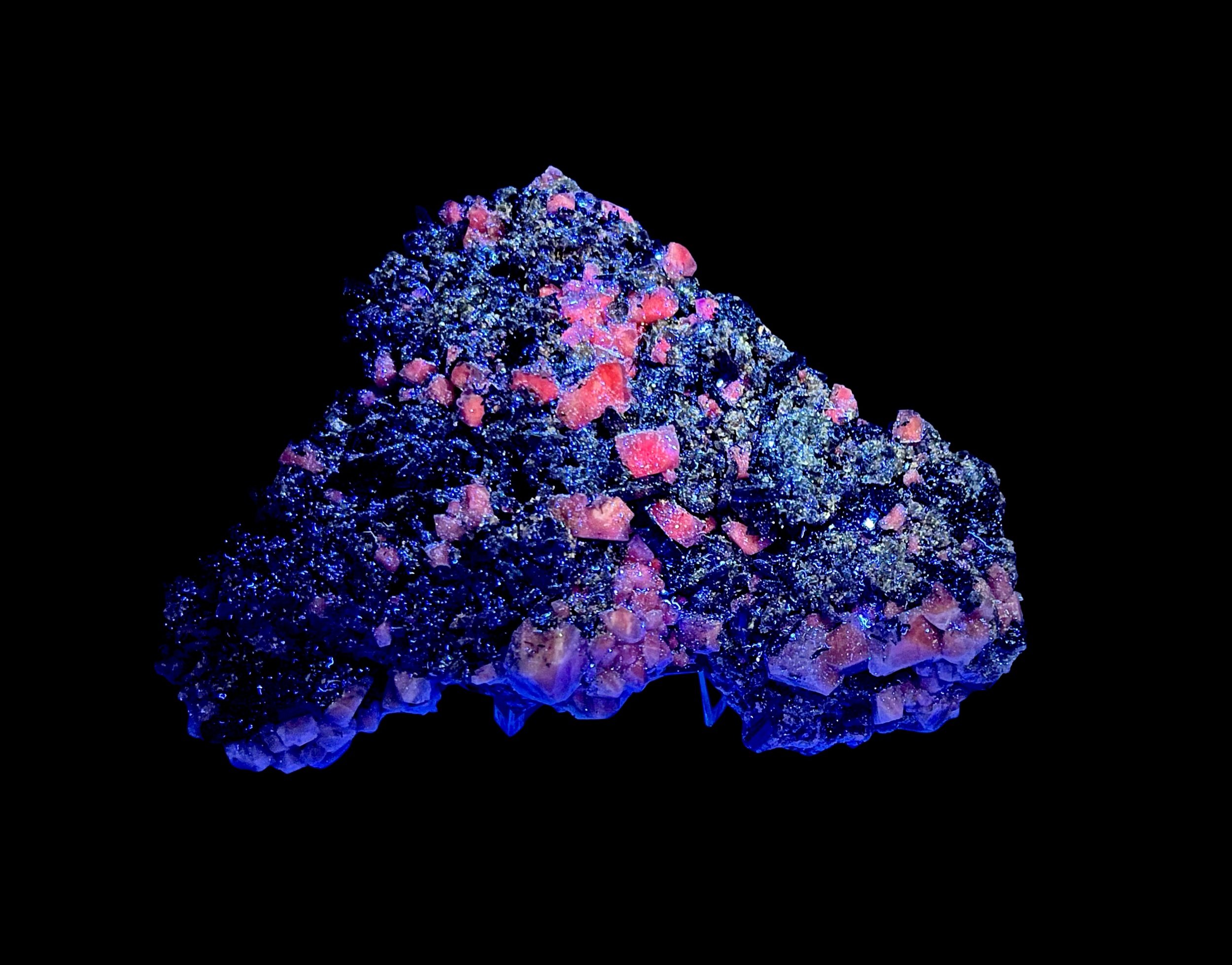 UV fluorescent calcite with black tourmaline crystals on quartz matrix