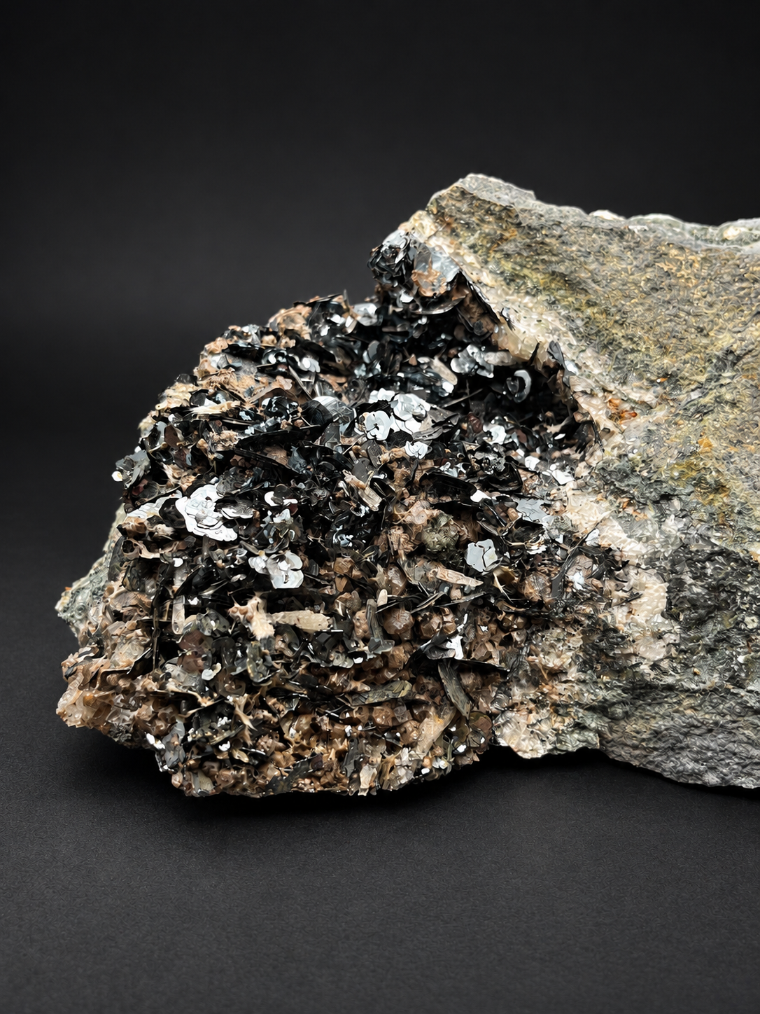 lustrous specularite hematite crystals from Nador, Morocco, showing overlapping metallic blades and brilliant silver-black reflections.