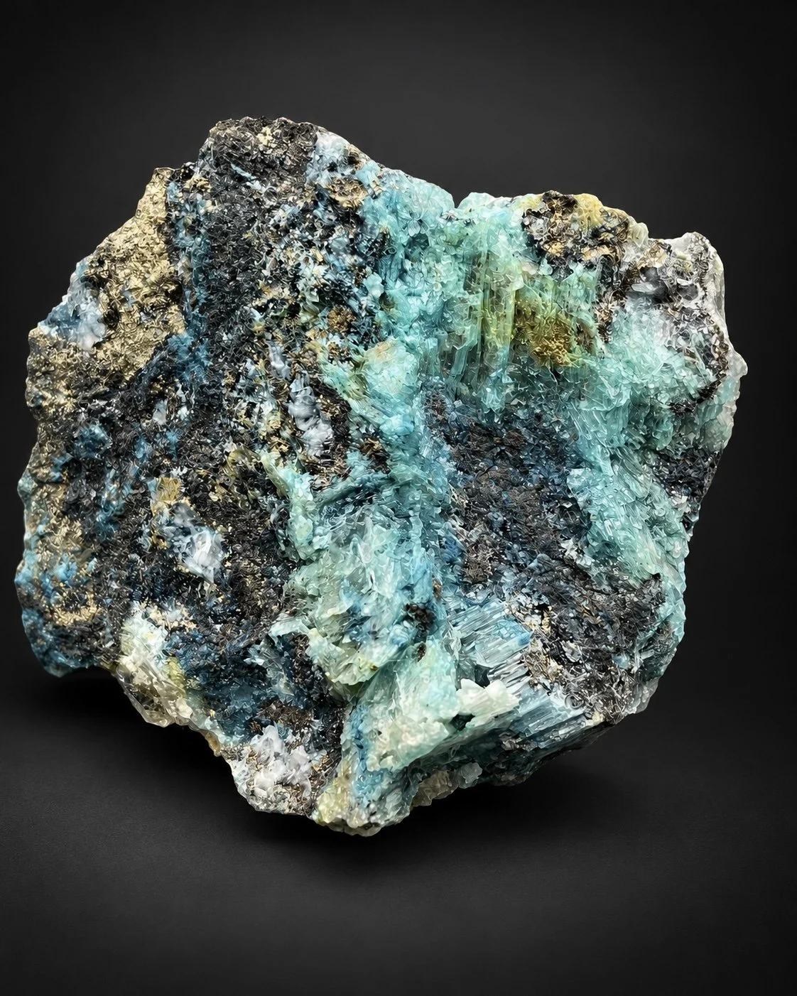 blue selenite specimen revealing an intricate pocket filled with clear to pale yellow crystals surrounded by turquoise mineralization.