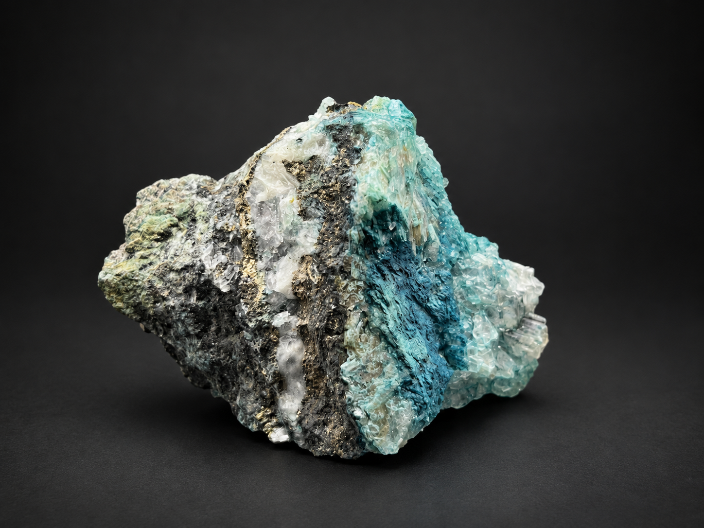 Blue Selenite on Shattuckite with sweeping turquoise-blue crystal formations extending over a dark mineral matrix.
