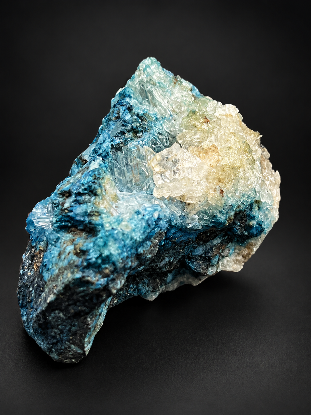 Blue Selenite on Shattuckite displaying icy-white and pale yellow crystal clusters above richly textured turquoise-blue mineralization from Ojuela Mine.