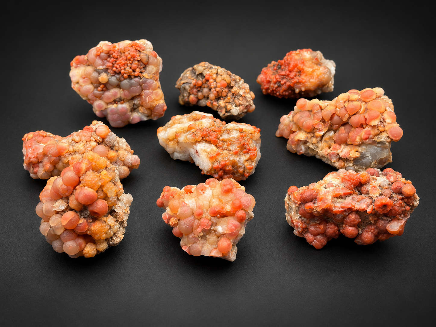 Natural Red Grape Agate specimens from Utah displaying orange, coral, peach, and pink botryoidal chalcedony formations