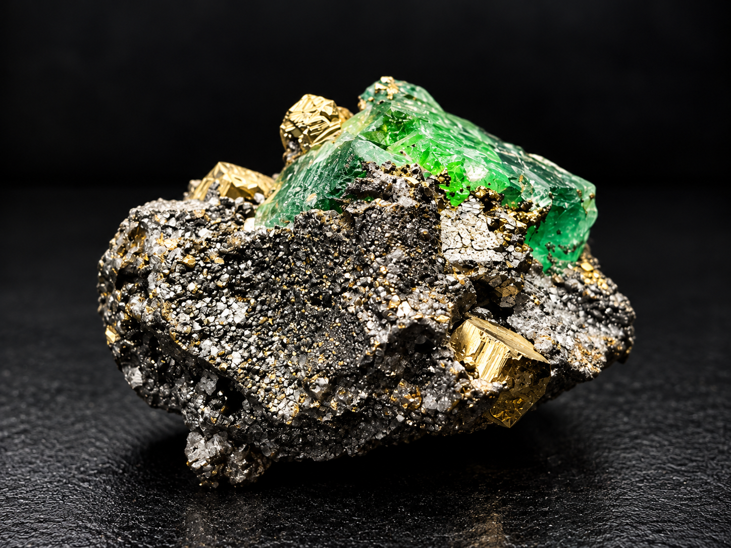 translucent green fluorite with intricate internal features, surrounded by metallic galena and golden pyrite crystals from Atacocha Mine, Peru.