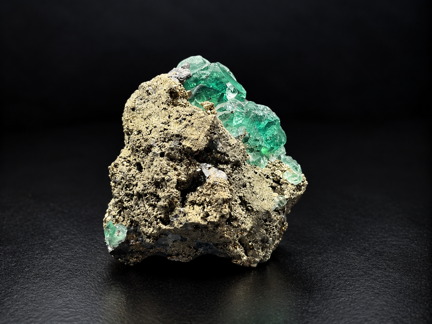 mint-green fluorite crystal clusters surrounding a silver-gray galena formation with golden pyrite accents on a natural Peruvian mineral specimen.