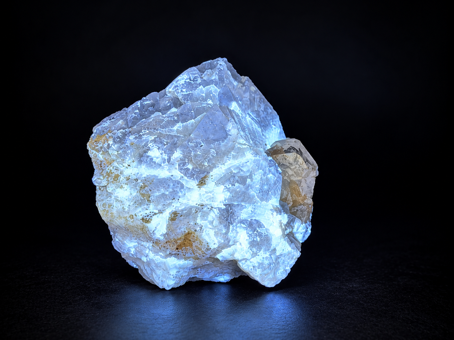 scheelite with transparent calcite crystals, pale muscovite, and darker mineral inclusions from Mt. Xuebaoding, Pingwu,