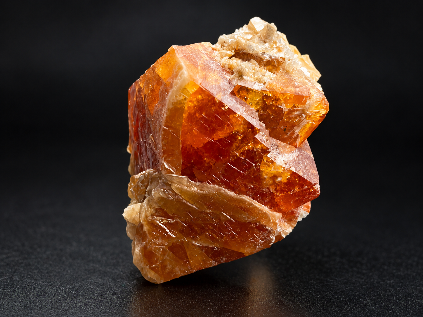 ivid tangerine and reddish-orange scheelite crystals revealing intricate internal features and intergrown dipyramidal forms from Mt. Xuebaoding, China.