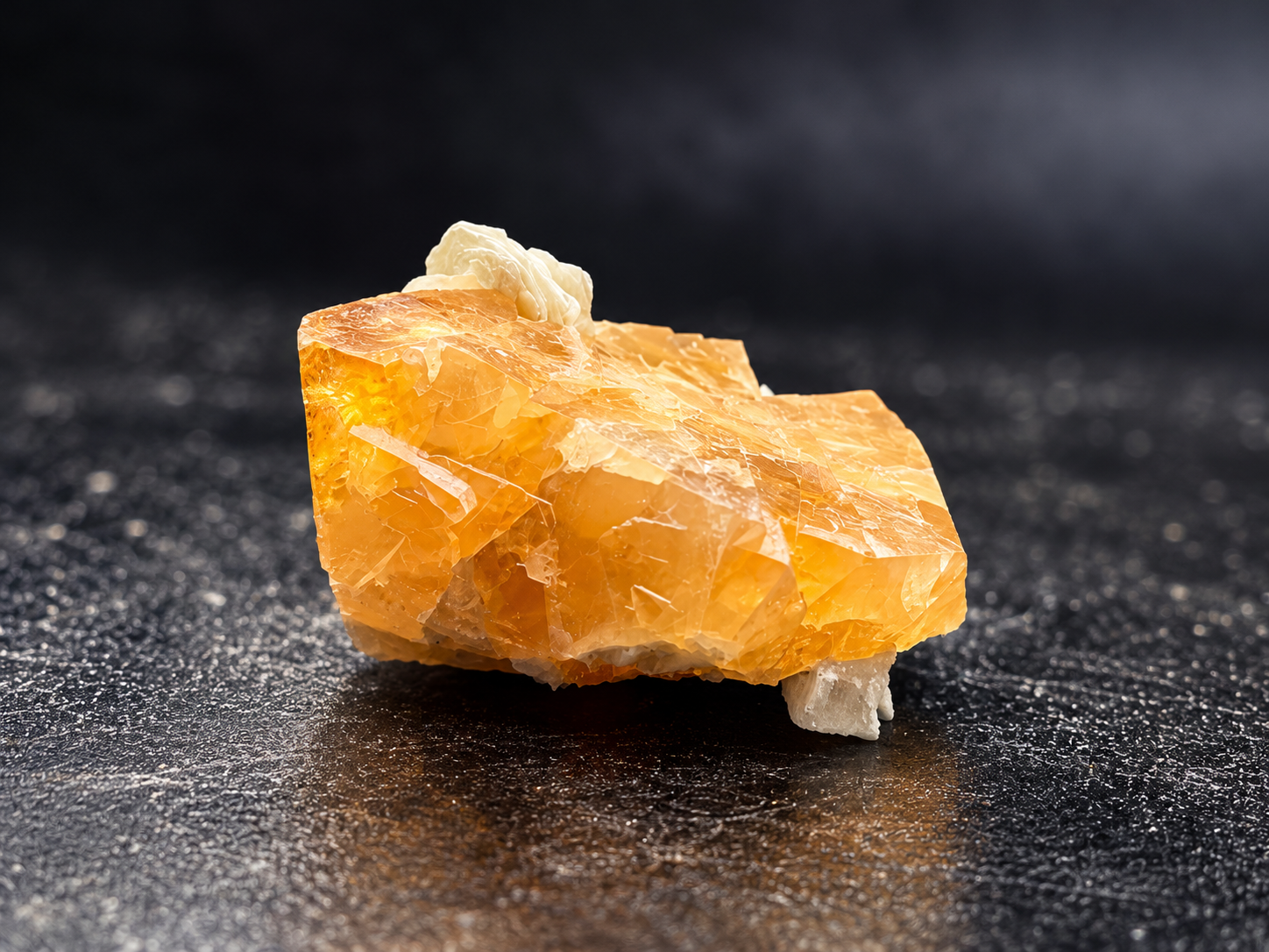 Golden-orange scheelite crystals with a cream-colored muscovite rosette from Mt. Xuebaoding, China, showing translucent faces and intergrown crystal formations.