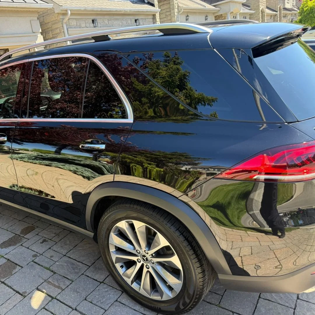 Professional car wax and automotive buffing using professional tools.