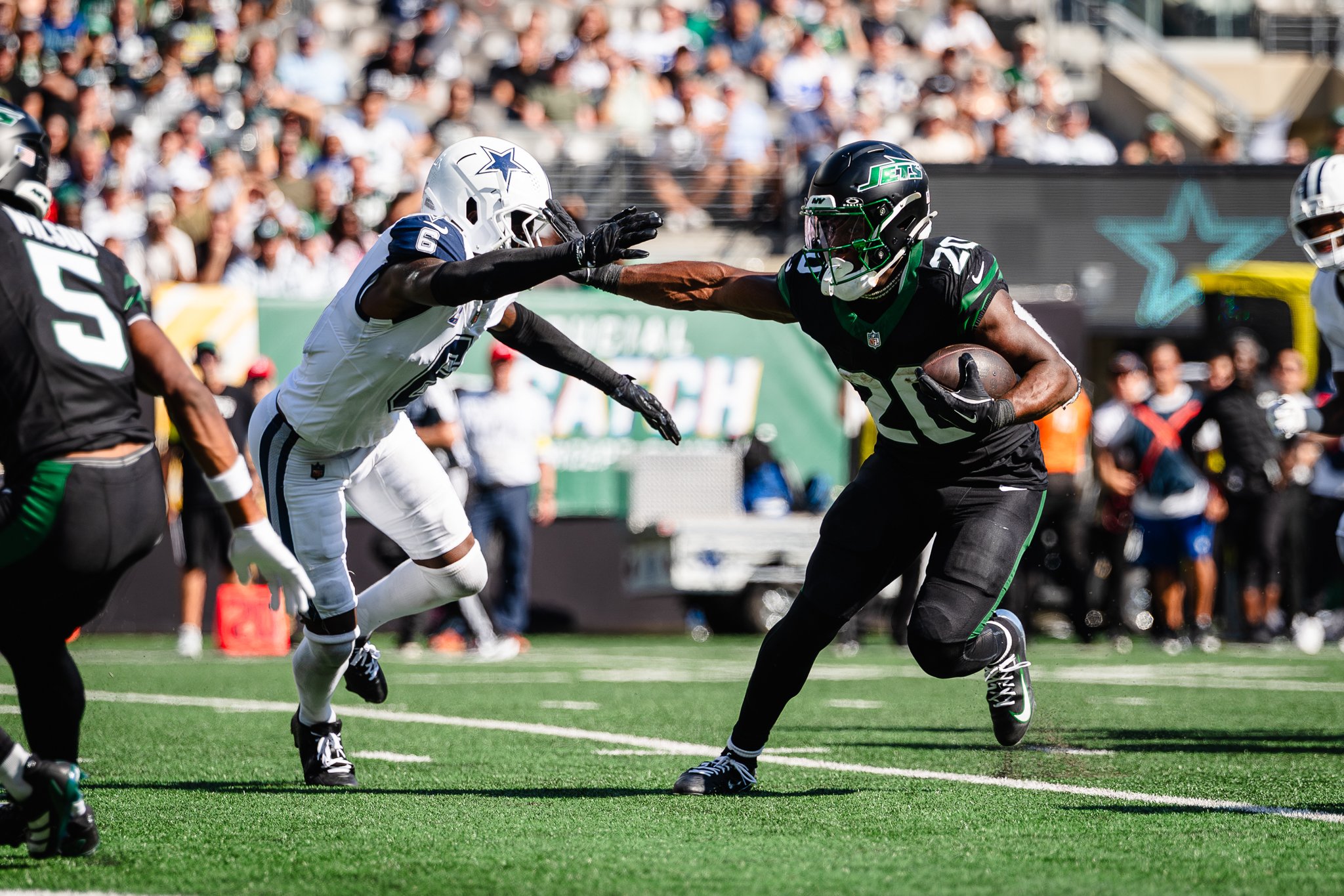 Breece Hall of New York Jets carries ball.