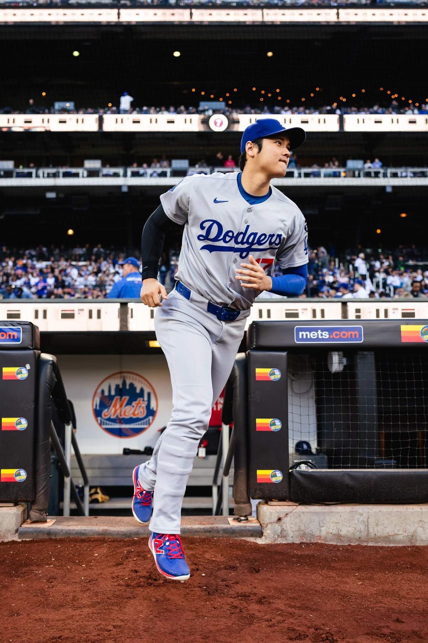 Shohei Ohtani of Los Angeles Dodgers runs on to field.