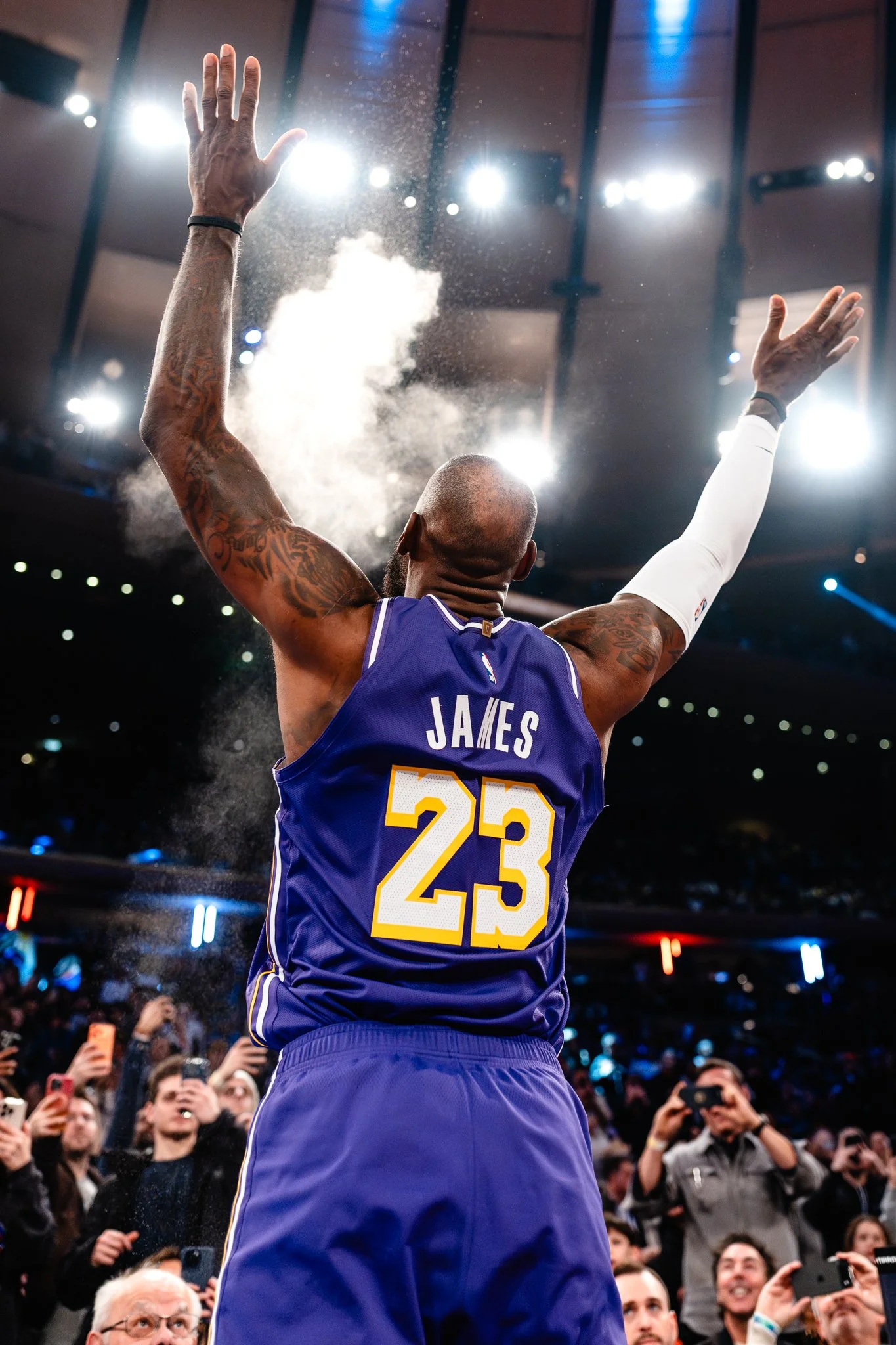 LeBron James of Los Angeles Lakers tosses chalk before game.